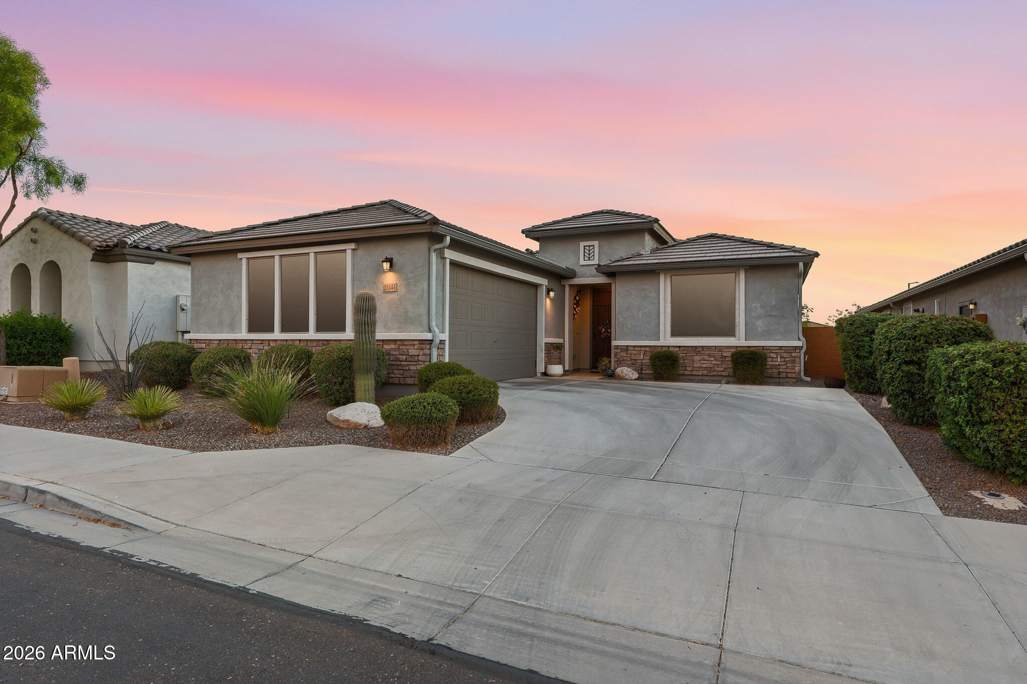 Welcome to resort-style living in this highly sought-after all ages Festival Foothills community in Buckeye! This beautifully maintained 3-bedroom, 2-bath home offers the perfect blend of comfort, elegance, and functionality. Step inside to discover an open-concept floor plan filled with natural light, enhanced by stylish plantation shutters throughout.

The gourmet kitchen is a true centerpiece, featuring premium cabinetry, ample counter space, upgraded appliances, and a large island ideal for entertaining or casual dining. The spacious primary suite provides a relaxing retreat with a well-appointed ensuite bath and generous closet space. Upgrades galore including custom lighting, extended patio areas, custom tiled shower in guest bathroom and comfort height toilets.  Enjoy the beautifully landscaped backyard complete with a charming gazebo and outdoor dining areas -- an ideal setting for relaxing mornings, outdoor dining, or entertaining under the Arizona skies. The oversized 2.5-car garage offers plenty of room for vehicles, storage, golf cart parking, or workshop space. Plug installed in garage to accomodate a Level 2 EV charger. Walking distance to the neighborhood dog park.