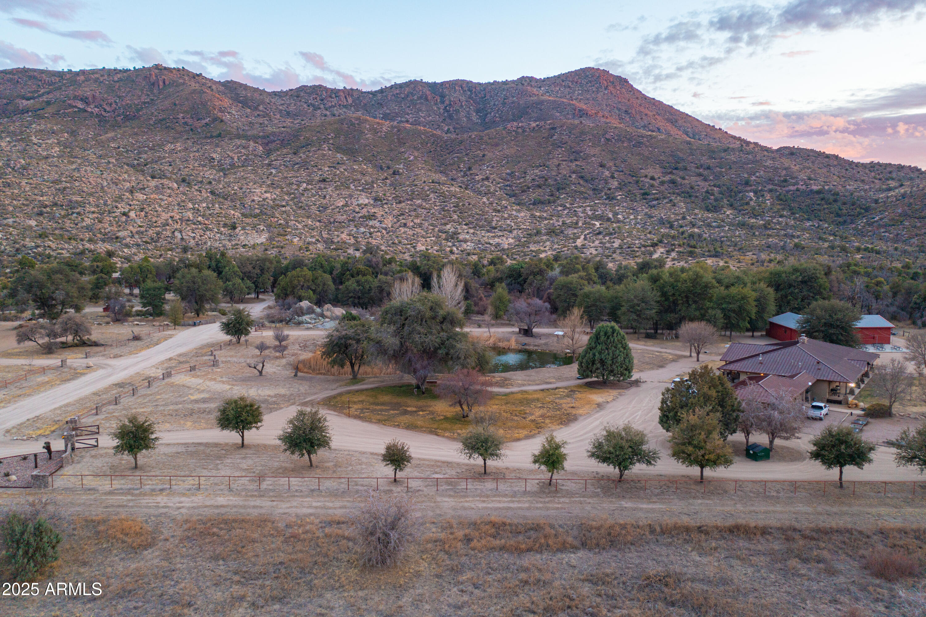 Once in a lifetime opportunity to own the incredible Luxury 3B Ranch in Top-of-the World, Arizona. This ranch consists of 20+/- acres that backs to Tonto National Forest.
The property can host over 40 guests. The exquisite main custom home has 4 br/3.5ba and a generous master suite with copper tub and walk-in closet. The main house also has an over-sized 3 car garage with private office and a bunk house.  The ''Guest House'' is a beautiful 3 bedroom 2 bath home, the ''Homestead'' is a 2 bedroom 1 bath home, the ''Motel'' is a 4 suite building with custom bunks for 18 guest and bathrooms in each suite. Shop Building, Event Barn with bathrooms, ATV Trails, Bass Pond & access to shooting range.  

Showings by appt only.

Watch Video link for full overview.