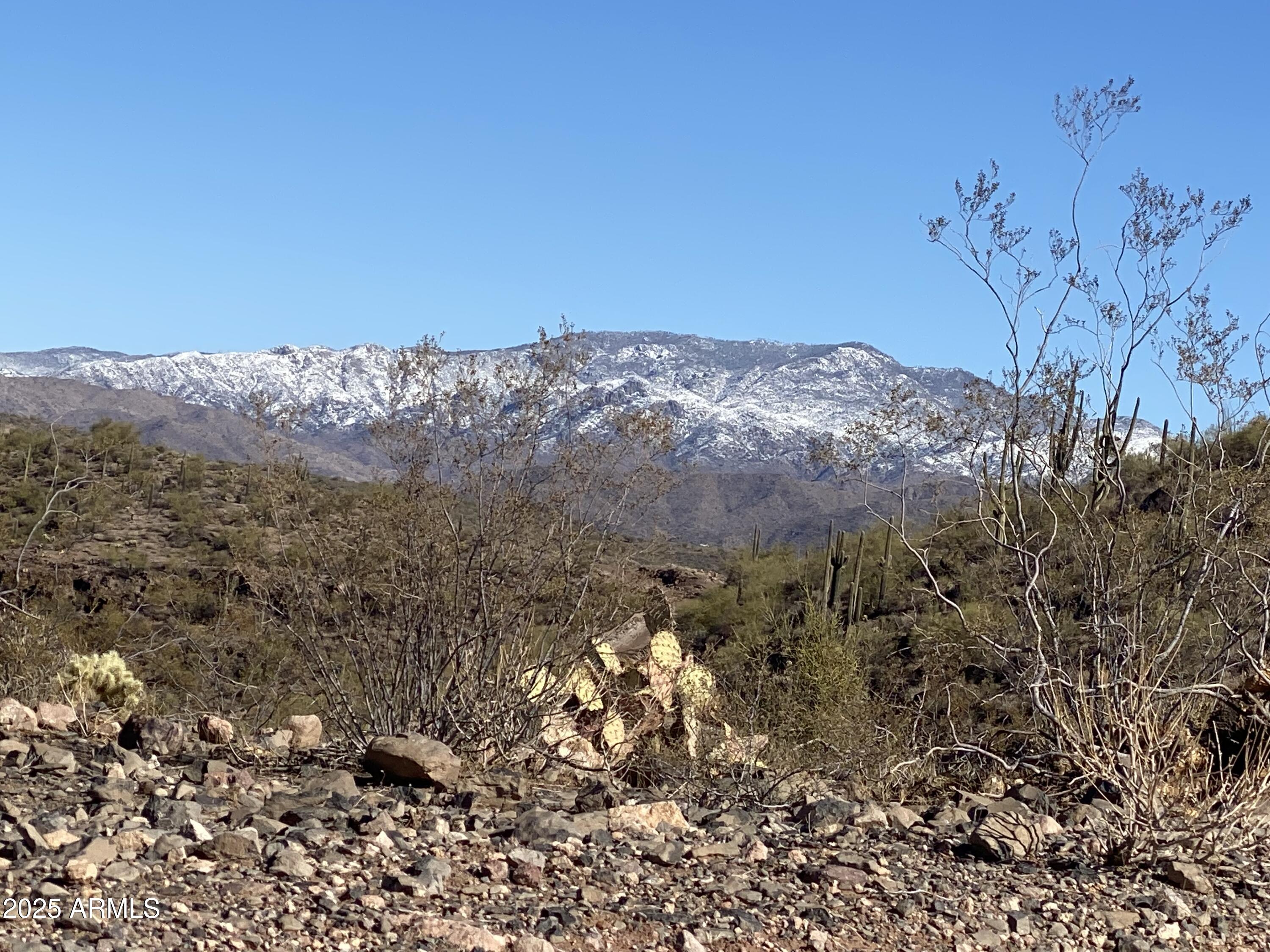 Located on rebel Pass for easy access with electric and east of the two spanish homes in beautiful Pleasant country ranches (4,000 ac)
No mobile homes no size limit of home or time to build  wells next across the road so possible to share a well.  Mountain views including Bradshaw Mtns (6,000 elev)  about ten degrees cooler in this area.  An additional two acres adjacent for sale.  Scorpian Bay marina and Pleasant harbor marina with restaurants,fishing boating ,camping,swimming.  city of Peoria has taken over land around the lake and plans to pave more of the road.  Now is the time to buy