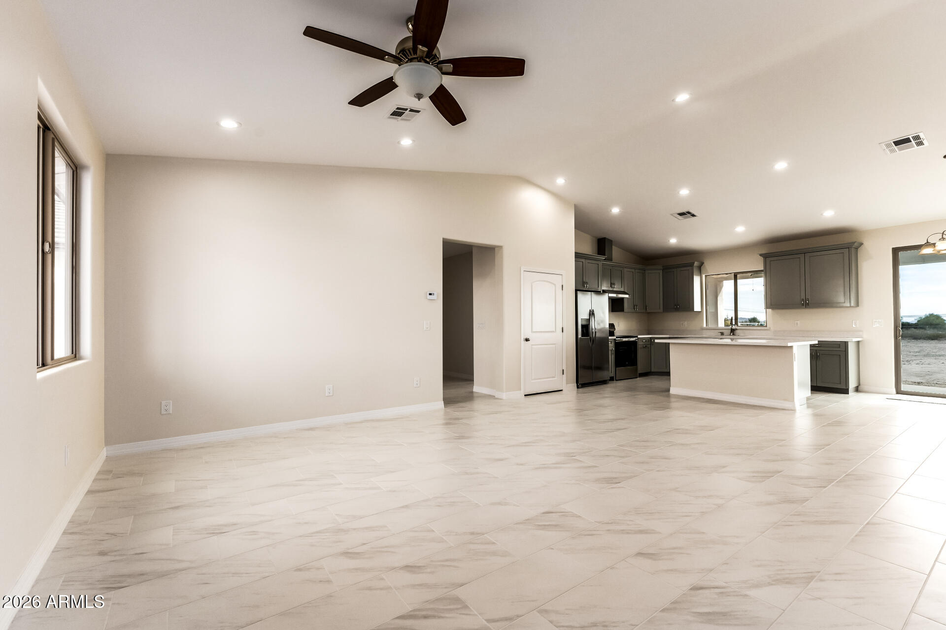 This is not your average new build. You truly have to see it for yourself. Set on over an acre, this beautifully designed ranch-style home offers space, comfort, and modern elegance. With 4 spacious bedrooms and 3.5 bathrooms, including two primary suites, the layout is ideal for multi-generational living or added guest privacy. The main primary suite is a true retreat with a luxurious en-suite bathroom featuring a separate soaking tub and walk-in shower.
The chef-inspired kitchen features a large center island, quartz countertops, and a walk-in pantry providing ample storage. Vaulted ceilings in the main living area enhance the open-concept design, creating a bright and airy space perfect for everyday living and entertaining.