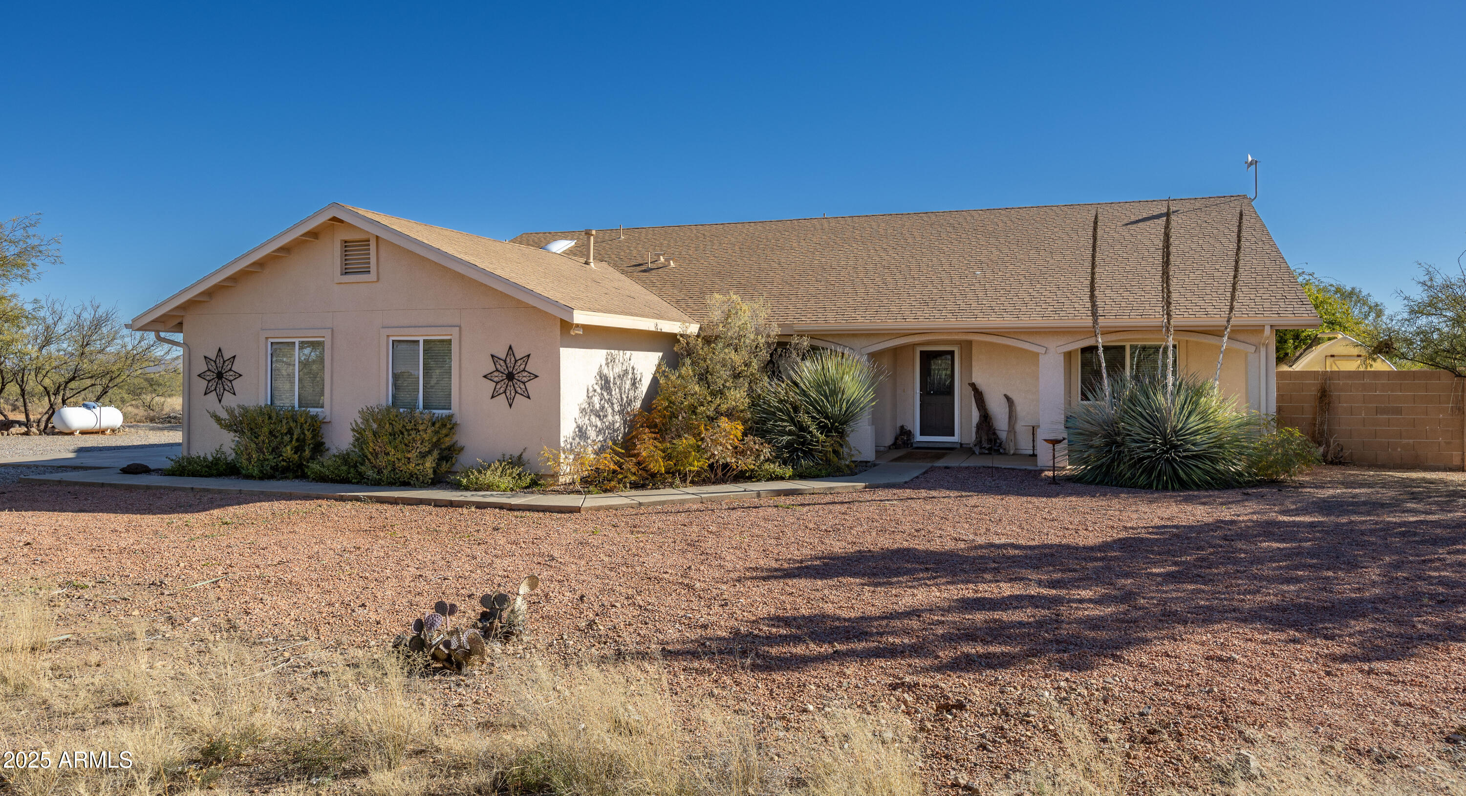 Beautiful 3-bedroom, 2-bath home with 1,764 sq. ft. of comfortable living on just over 4 acres. The split floor plan offers privacy, featuring a spacious primary suite with dual sinks and a roll-in shower. Vaulted ceilings and a gas log fireplace create an open, inviting main living area.

The kitchen includes a walk-in pantry and flows seamlessly into the dining and living spaces perfect for everyday living and entertaining. A dedicated office with French doors provides a quiet workspace or flex room.

Additional highlights include covered front and back patios, a greenhouse, block wall backyard fencing, a 2-car garage, and a 1/2 well share offering space, function, and peaceful country living.