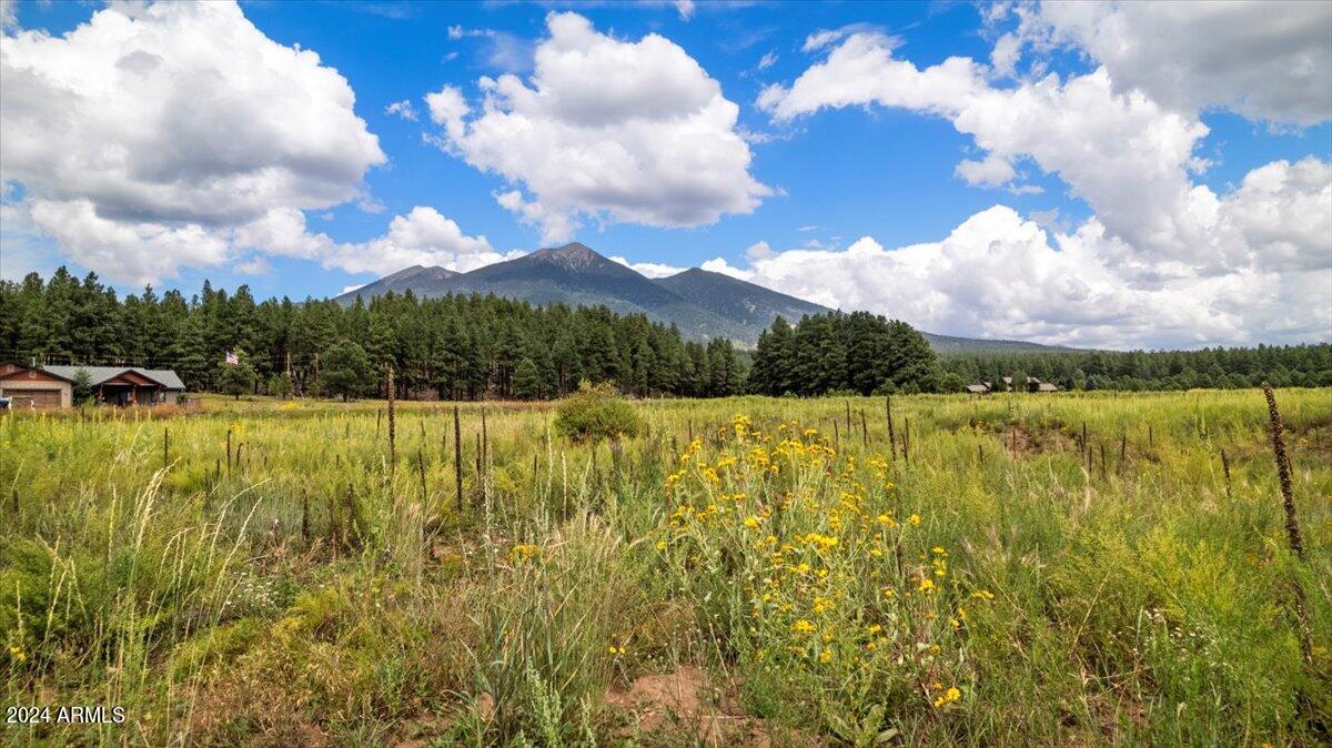 Welcome to Ranch at the Peaks, an exclusive, serene community offering spacious home sites with breathtaking views of the San Francisco Peaks. Each lot, approximately 2 acres in size, is equipped with water, electric, cable from the Majestic View Domestic Water Improvement District and natural gas from Unisource Energy. Embrace the tranquility of mountain living while enjoying unparalleled vistas, direct access to trails, and nearby opportunities for hiking and skiing. Build your dream home in this picturesque setting and experience the perfect blend of natural beauty and modern convenience.