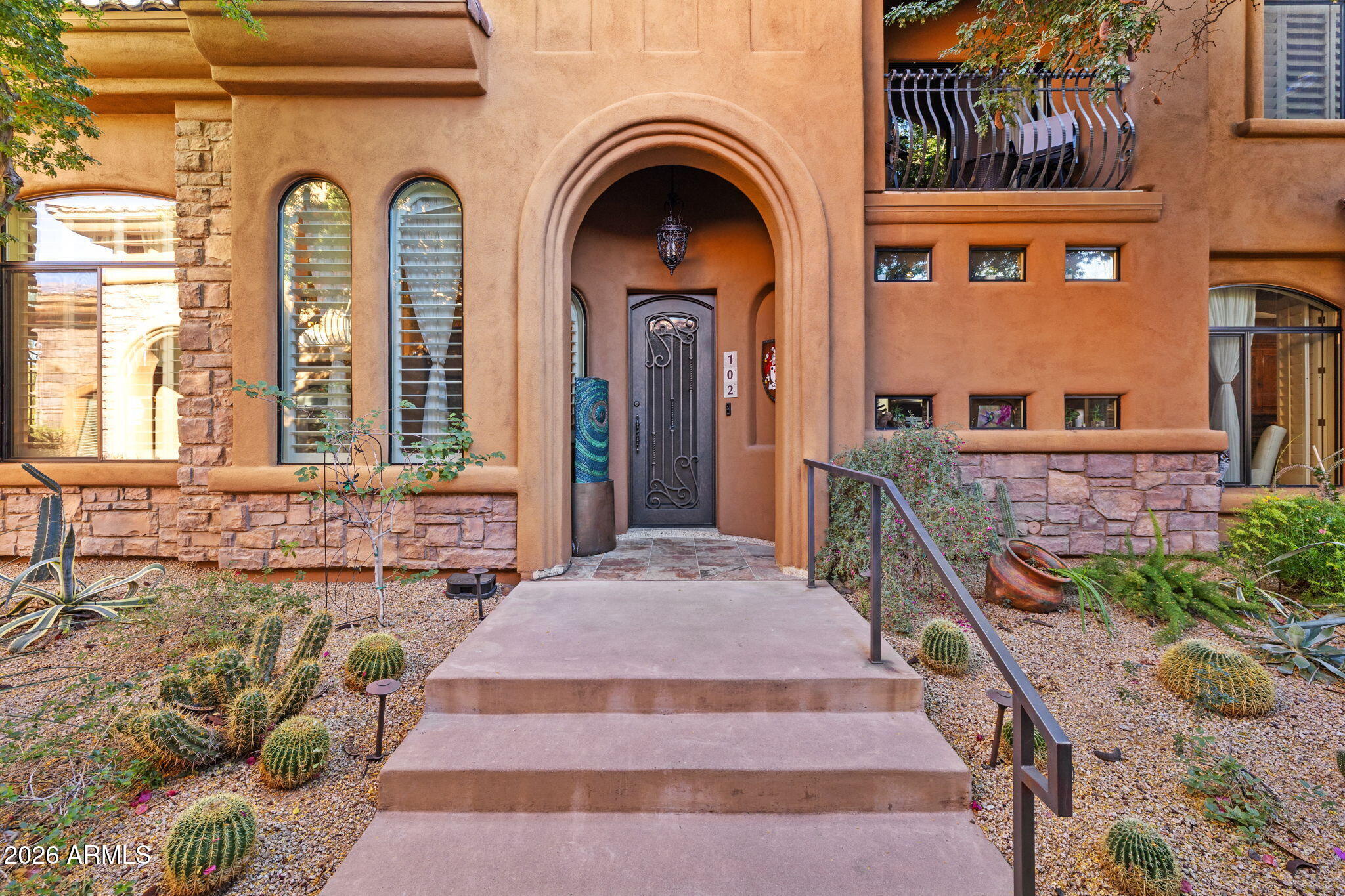 Experience refined desert living in this stunning turn key 3-bedroom + office 3-bathroom Townhome in the gated Montacino Villas of Carefree AZ, walking distance to the Carefree Sundial and shoppes and the charming downtown of Carefree. Home features exquisite, upgraded finishes, a chef's kitchen with granite and a brand new Wolf gas stove, eat in kitchen with lots of light from the clerestory windows, gas fireplace with hand carved Texas Limestone floor to ceiling decorative mantle. Primary bdrm and 2nd bdrm on 1st floor. 3 bedrooms each with their own baths, Cantera iron entry and patio doors with swing out screening, 2nd floor bedroom has an office area and it's own private balcony. Recently installed electric tankless water heater and whole home water purification system.