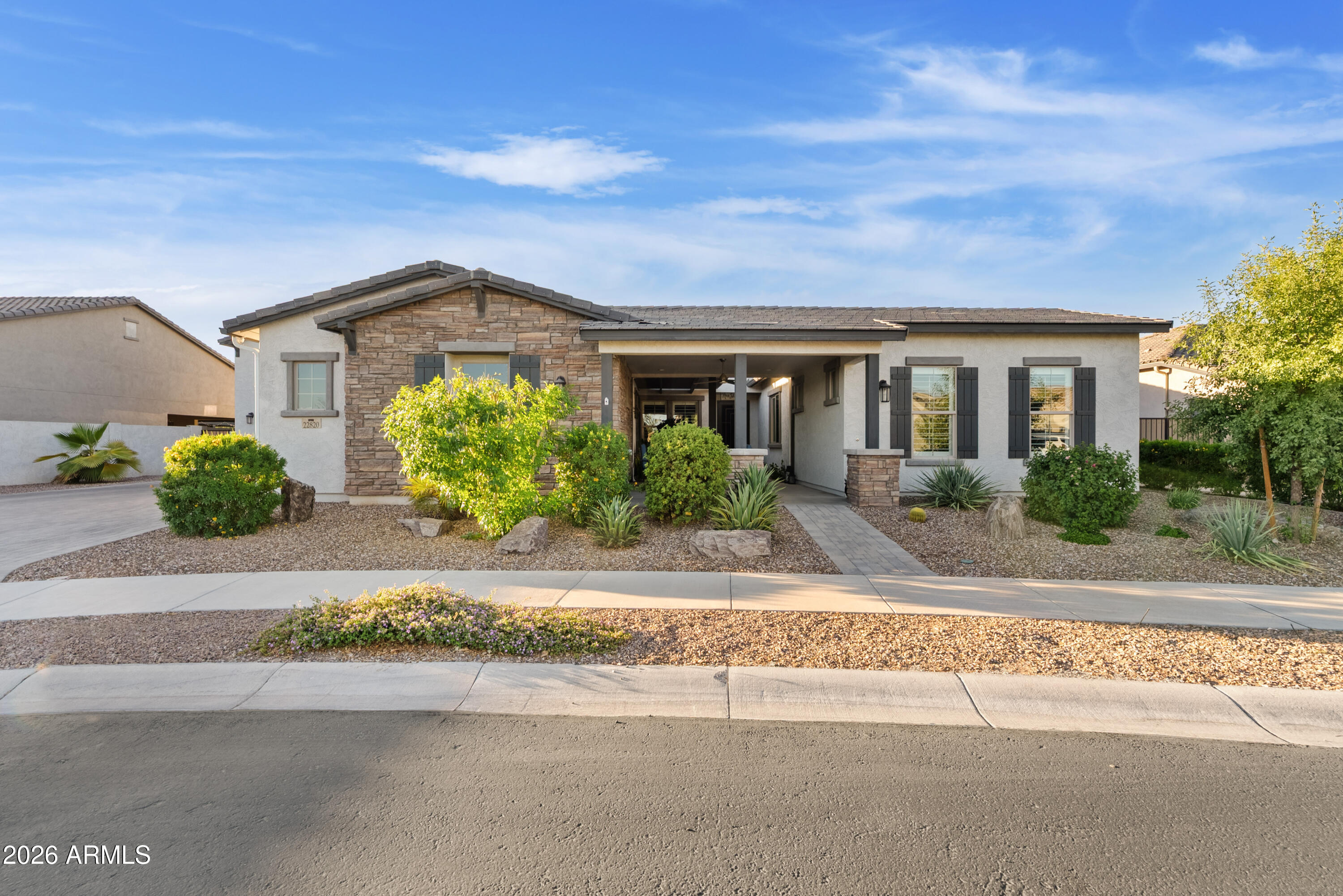 Welcome to this stunning single level TriPointe home in the gated community of Spur Cross. This 4-bedroom, 4-bath home features a split floor plan, fresh interior paint, plantation shutters, and a chef's kitchen with quartz countertops, upgraded appliances, oversized island, walk-in pantry, and designer finishes. The great room offers an electric fireplace and surround sound. Enjoy a resort-style front & backyard with tranquil bubbling water feature, heated pool, spa, pergola, ramada with built-in BBQ, and mature landscaping (including citrus trees). A rare 20'x50' detached RV garage with mezzanine loft and dual mini-splits, plus a 3 car garage with mini-split A/C, extended paver driveway and permanent holiday lighting complete this exceptional property.