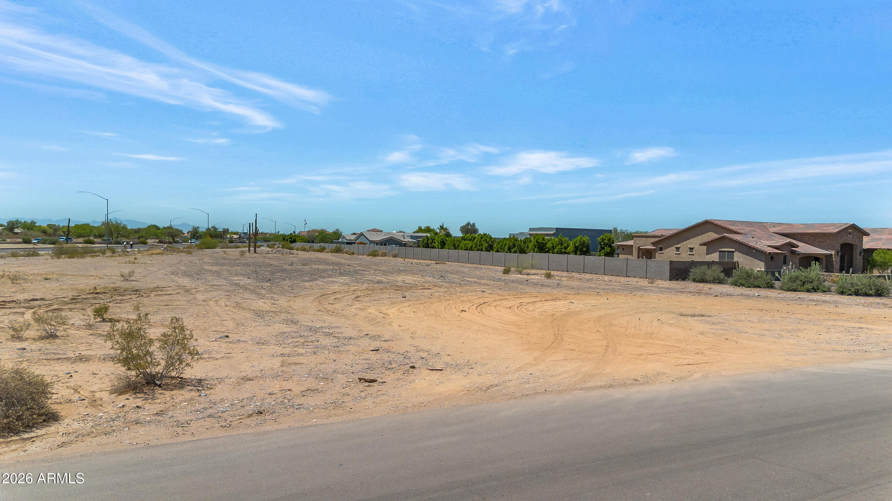 Fantastic oversized custom home lot with 140 feet of width -- much larger than the typical single-acre parcel! Surrounded by beautiful custom homes, this is the perfect opportunity to build your dream home in a peaceful country setting while still being close to everything. Shared well are already in place. Located in unincorporated Maricopa County (not the City of Peoria). Great location near shopping, restaurants, public and charter schools, the 303 Freeway, library and beautiful Lake Pleasant. Hard to find a lot this size at this price!