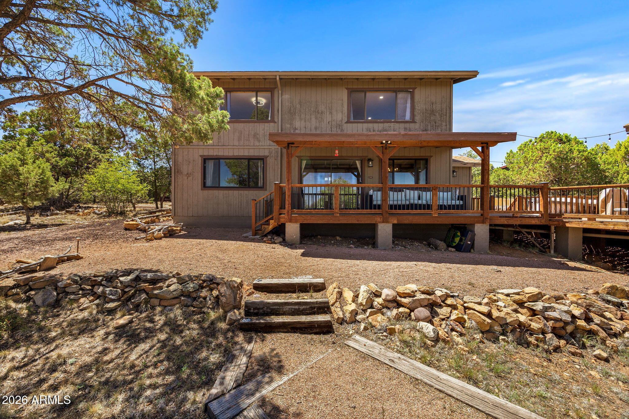 Take in breathtaking, panoramic White Mountain views from this beautifully updated, fully furnished home in desirable High Country Pines. Designed for gathering while still providing privacy, this property features a spacious main home plus an 896 sq. ft. guest quarters above the oversized detached garage. The open concept main home offers comfortable living and entertaining space, while expansive covered decks showcase incredible year round views and spectacular 4th of July fireworks. The separate guest quarters, mini kitchen, and full bathroom provide the perfect retreat for family and friends. Whether hosting multiple families, accommodating extended guests, or creating a vacation rental opportunity, this unique property offers the ideal balance of togetherness and personal space all surrounded by the beauty and tranquility of the White Mountains.