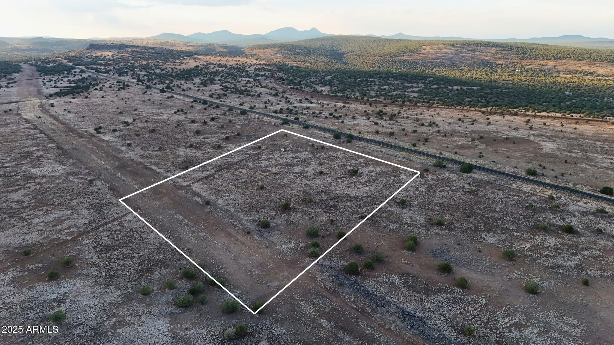 Prime 10.31-acres parcel, sits just right off of the main old state route 66 hwy. This property is perfectly situated, in Juniperwood Ranch area, about 45 miles north of Chino Valley in Yavapai County, Arizona.Surrounded with juniper and pinon trees. You can build your own private dream house, in which you can relax and enjoy the beautiful scenery with awesome skies and wildlife. It is prime acreage within minutes to the National Forest Land, to mountains, lakes, streams, etc. fishing, hunting, camping and more all in your back yard. Surrounding attractions: located south of Ash Fork and close to Williams and Flagstaff with all amenities, there is just so much to see and do including the Grand Canyon National Park, Kaibab National Forest, Prescott National Forest, San Francisco Mtns, Bill Williams Mtns, Juniper Mtns, Route 66 Heritage, and more! A great opportunity to even own the parcel next to it, which is also for sale, for a possible 20-acre total lot acquisition! Act fast before it's gone!