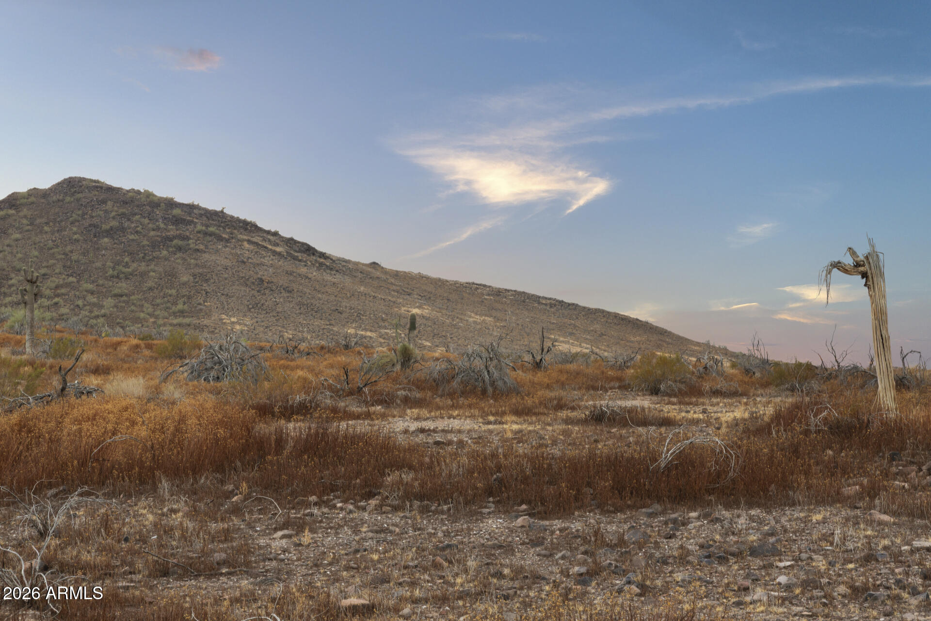 Gentle sloping Phoenix low desert land w/ no HOA, all the mountain views, city lights & space to create a residential retreat. Easy lot(s) to build on, perfect for the outdoor enthusiast that needs room to build an RV garage, multigenerational space, room for horses, toys, casitas you name it. This rectangular shaped 5.36 acre parcel is evenly balanced to split off into 4 or 5 plots w/ room for easements according to R-43 zoning. Just off of I-17 and Carefree Highway, this central location is great access for various commutes as well as Northern Arizona recreation. Nearby TSMC plant is expected to shoot values up. This is bulk price for total parcel. Land is also listed separately for lot release purchase. Seller is an experienced licensed contractor w/ excavation, septic installation & lot improvement capabilities. Depending on terms, seller may provide an allowance towards some improvements. Ask about options. Power is at the road and can be brought underground, this area needs septic installed, and also a well needs to be installed. If needed, separate agreements for possible lot improvements can be made in order to get this land up and running and ready to be transformed into a place to call home. Perfect for investors, builders, or a buyer dreaming to own their own estate in the heart of the Arizona valley.