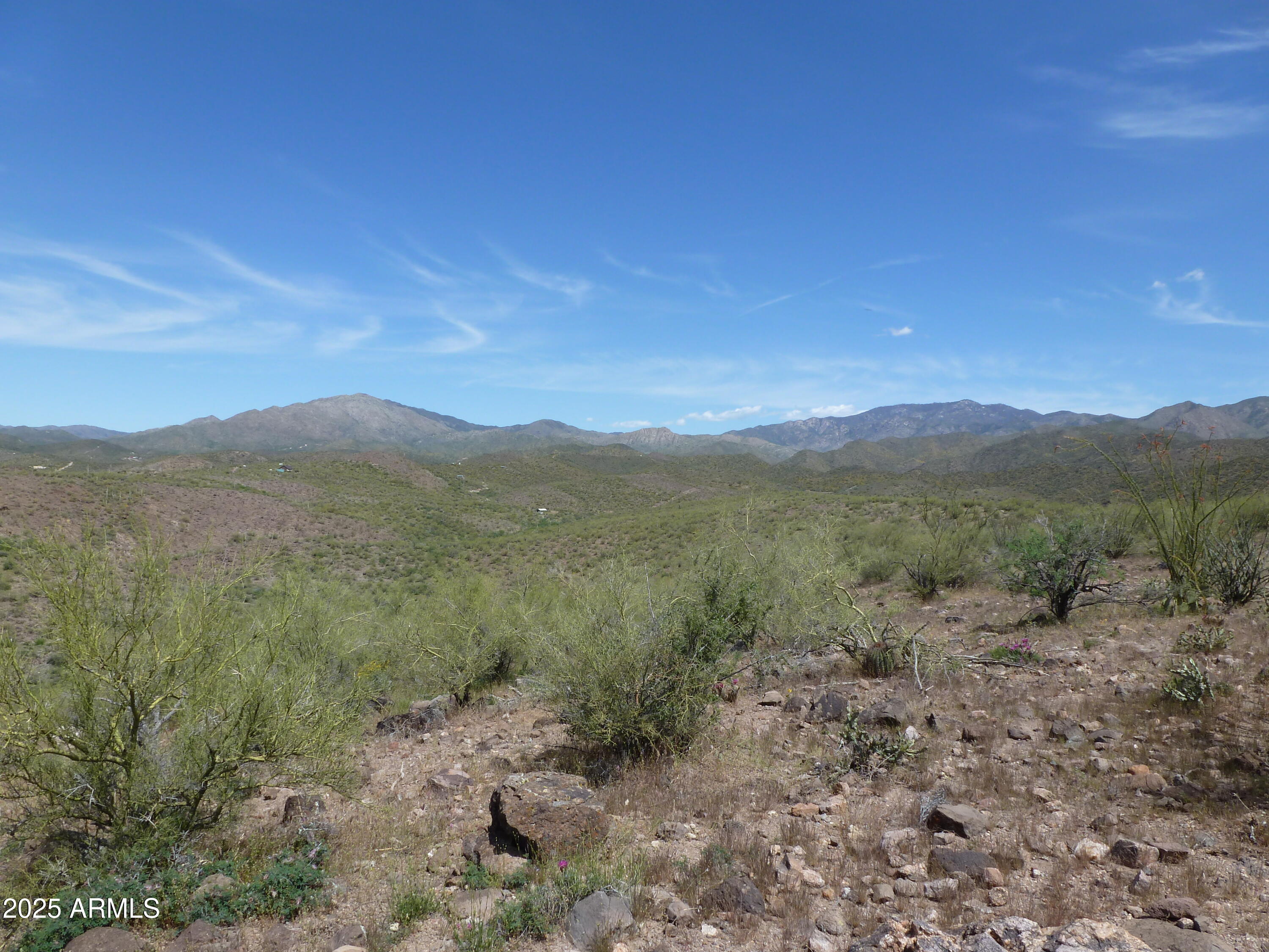 Stunning 4+ Acre premium parcel with views, backing to BLM land & easy access in Pleasant Country Ranches. Don't miss the opportunity to own in an increasingly popular area nestled in the foothills of the Bradshaw Mountains, close to Lake Pleasant, Dillons By the Bay, the famous Castle Hot Springs Resort and miles of ATV riding right off your property. It's not far to Peoria for all the shopping and services you need. The zoning is one house per 2 acres with guest houses. RV garages are ok. There are 3 other contiguous parcels for sale for a total of 20.19 Acres. Buy all of them so your friends and family can build and enjoy the quiet life. SURVEY IS UNDER THE DOCUMENT TAB. THESE ARE PARCELS A & B on the survey. The wells in the area average from 100 to 400 feet. Mobile homes are not allowed. Yavapai County has free building plans to make your permitting experience easier.  
Taxes are estimated. 
The survey is under the document tab.