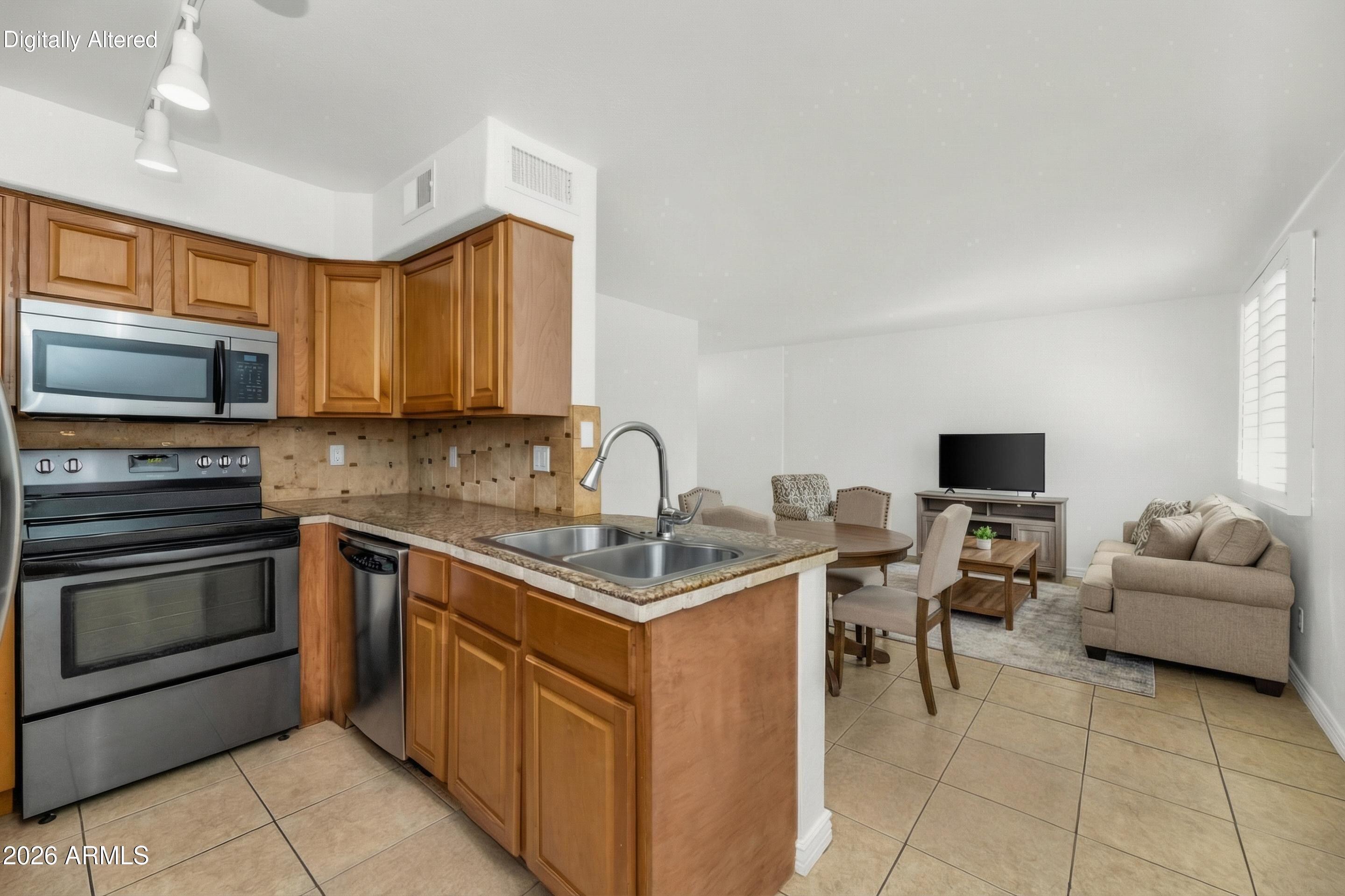 Old Town Scottsdale condo with ideal location.  One bedroom/one bathroom condo with tile throughout.  Kitchen features stainless steel appliances and granite counter tops.  Entertain in the large living room with expanded space for an office, gaming area, or hobby area.  French doors lead to the patio for outdoor entertaining or enjoying the beautiful Arizona sunsets.  Spacious bedroom with large closet.  Monthly HOA includes all utilities.