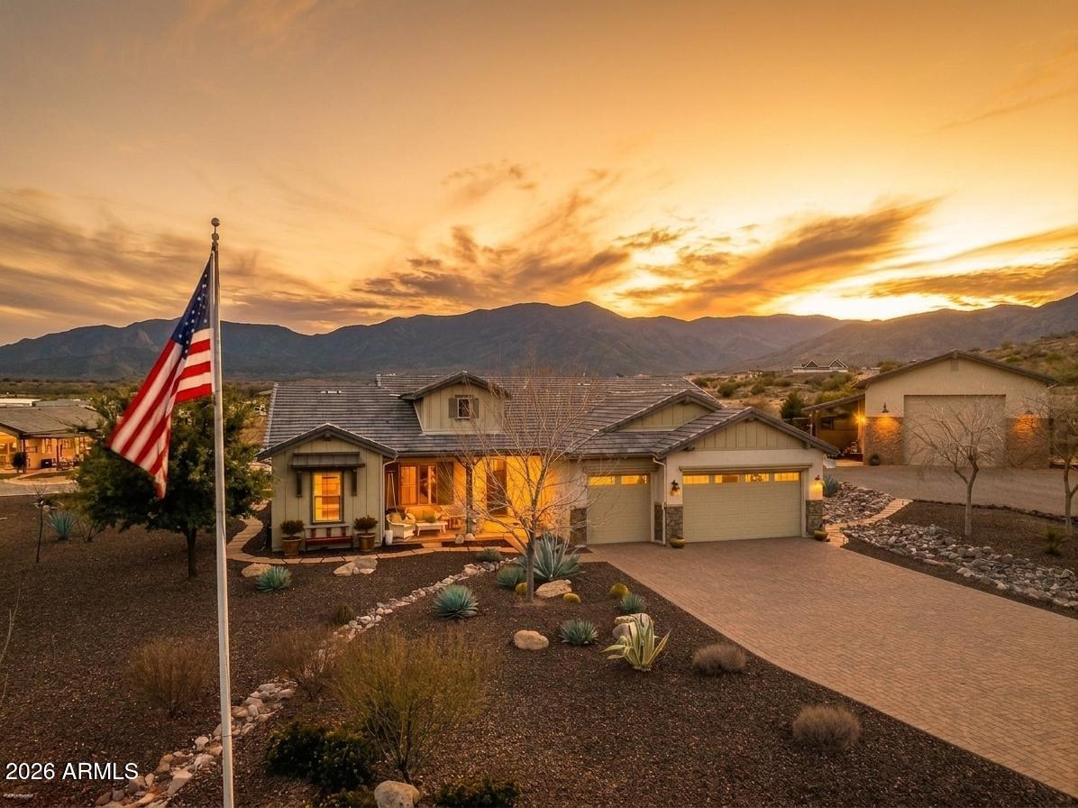 Rarely does a property of this magnitude, sophistication, and sheer capability become available. Spanning two private parcels totaling 3.63 pristine acres, this gated estate is a masterclass in intentional luxury--combining a sprawling main residence, a fully independent spa-like guest casita, a premier private pickleball court, and an engineered 1,750 sq ft RV garage.

The Main Residence (2,545 Sq Ft):
Step into an sun-drenched sanctuary defined by beamed cathedral ceilings and five architectural solar tubes. The chef's kitchen is a design masterpiece featuring premium granite, custom tile, a farm basin sink, high-end cabinetry, a massive walk-in pantry, and GE Profile stainless appliances. The thoughtfully designed split floor plan offers 3 spacious bedrooms, 2.5 baths, plus a dedicated flex office/creative space.

The Outdoor Oasis & Off-Grid Peace of Mind:
The great room flows seamlessly to a 734 sq ft covered entertainer's patio, fully equipped with a custom outdoor kitchen, fireplace, and private hot tub overlooking meticulously landscaped grounds. Built for absolute self-reliance, the estate features a paid-in-full solar system and a Generac 24kW natural gas generator, ensuring uninterrupted comfort.

The Guest Casita & Recreation Oasis (Parcel 2):
Completely independent with its own utilities and private garage, the 768 sq ft guest casita feels like a five-star resort. It boasts acid-etched floors, cathedral ceilings, a full kitchen, a built-in wet bar with an ice maker and wine cooler, and a custom tile spa bath. Step outside to its private covered patio and your own private regulation pickleball court. Bonus: This second parcel is fully buildable for an additional future residence if desired.

The Ultimate 1,750 Sq Ft custom RV Garage:
A dream space for collectors and hobbyists, this fully finished and insulated toy barn features a 16'x14' commercial door, custom flooring, hardboard lower panels, a storage mezzanine with wide staircase access, a thermostatically controlled attic exhaust fan, and a dedicated heated/cooled storage room.

Infrastructure & Additional Highlights:
Attached 3-car main garage (704 sq ft) with pristine epoxy floors.
Premium water management: Whole-home softener, full gutters, and a 1,000-gallon rainwater storage harvest tank.
Exterior perfection: Chip-sealed driveways, flagstone walkways, custom stone ground cover, and automated drip irrigation.

Energy-efficient, meticulously executed, and offering a level of versatility that cannot be replicated--this isn't just a home; it's a private legacy compound.