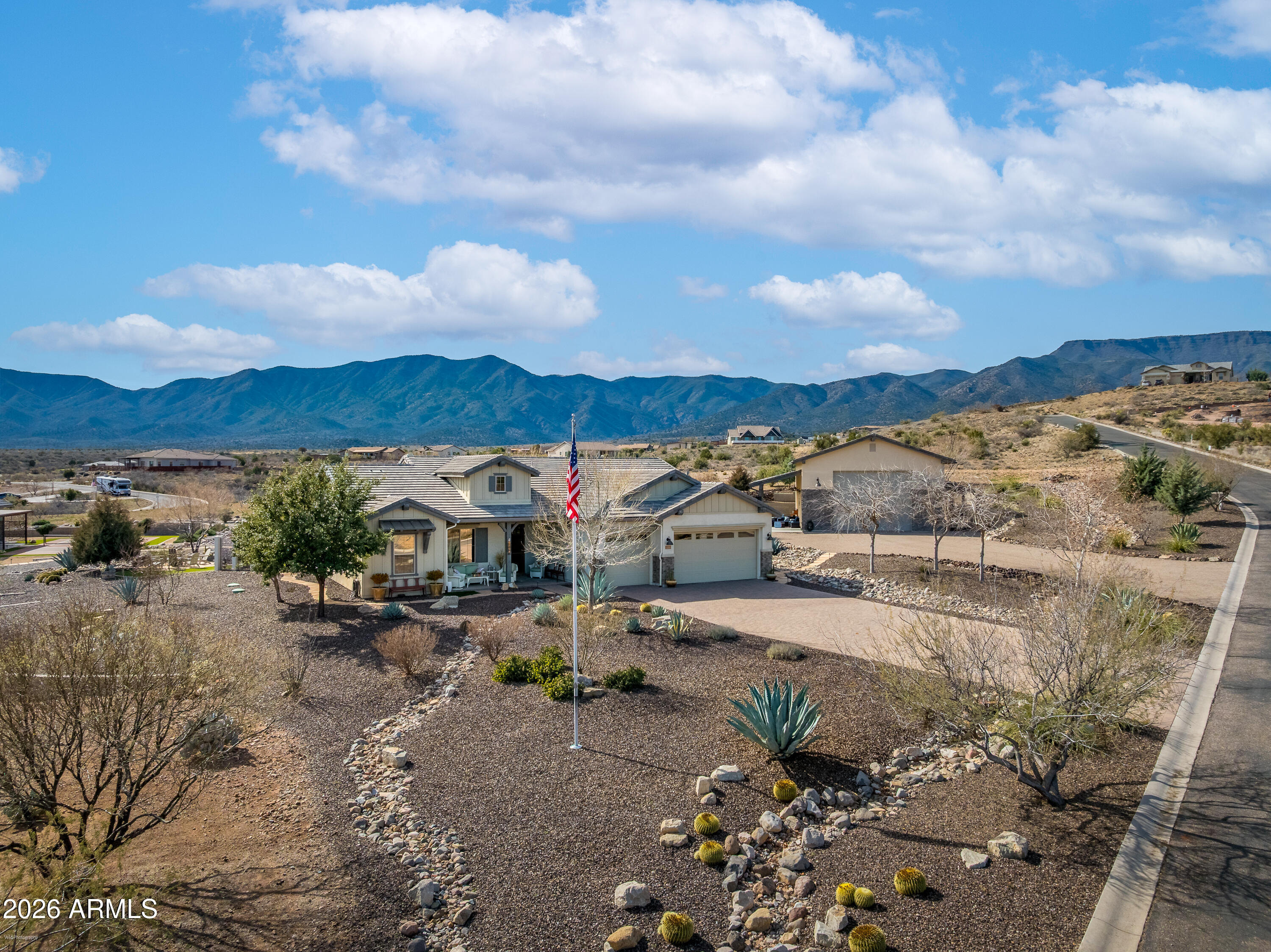 Luxury, intention, and lifestyle come together in this 2,500+ sq ft luxury home, complete with a spacious guest casita, private pickleball court, RV garage, and gated privacy within the sought-after Quail Canyon Subdivision.

The main residence offers 3 spacious bedrooms, 2.5 bathrooms, and a flex/ office/creative space.. The great room features beamed cathedral ceilings, and five interior solar tubes that flood the space with natural light. The chef's kitchen is thoughtfully designed with granite countertops, custom tile backsplash, large farm basin style sink, designer fixtures, top of the line cabinetry, a huge pantry, and high end GE Profile stainless steel appliances.

Efficiency meets peace of mind with a Generac 24kW natural gas generator and a paid in full solar system. Enjoy elegant outdoor living with the covered patio that transforms into an entertainer's dream, featuring an outdoor kitchen, fireplace, and hot tub, all overlooking beautifully, intentionally landscaped grounds. 

Parcel 2 is home to a fully appointed guest casita, complete with its own garage and independent utilities. Designed impeccably to feel like a spa retreat, the casita features acid-etched floors, beamed cathedral ceilings, a full kitchen with electric cooktop, convection microwave, dishwasher, plus a built-in bar with ice maker and wine cooler. The spa-like bathroom includes a large custom tiled shower with glass enclosure. Step outside to your own private covered patio and a pickleball court, creating a one-of-a-kind recreational experience.

You will appreciate the 1,750 sq ft custom RV garage, featuring a 16' wide x 14' tall RV door, custom flooring, hardboard lower panels, fully finished and insulated, and a storage mezzanine with wide staircase access, a heated and cooled storage room, attic exhaust fan on thermostat. 

Additional highlights include an attached 3-car garage with epoxy floors, a whole-home water softening system, drip irrigation, stone ground cover, flagstone walkways, chip-sealed driveways, full gutter system with a 1,000-gallon rainwater storage tank and a second parcel (could be home to another residence) for a total of 3.63 acres of pristine privacy. Main home 2545 sq ft, main home garage 704 sq ft Guest Home 768 sq ft, guest home garage 300 sq ft RV Garage/Loft Space 1751 sq ft, outdoor kitchen/patio 734 sq ft. 

Energy-efficient, meticulously designed, and beautifully executed, this property isn't just a home, it's a lifestyle statement.