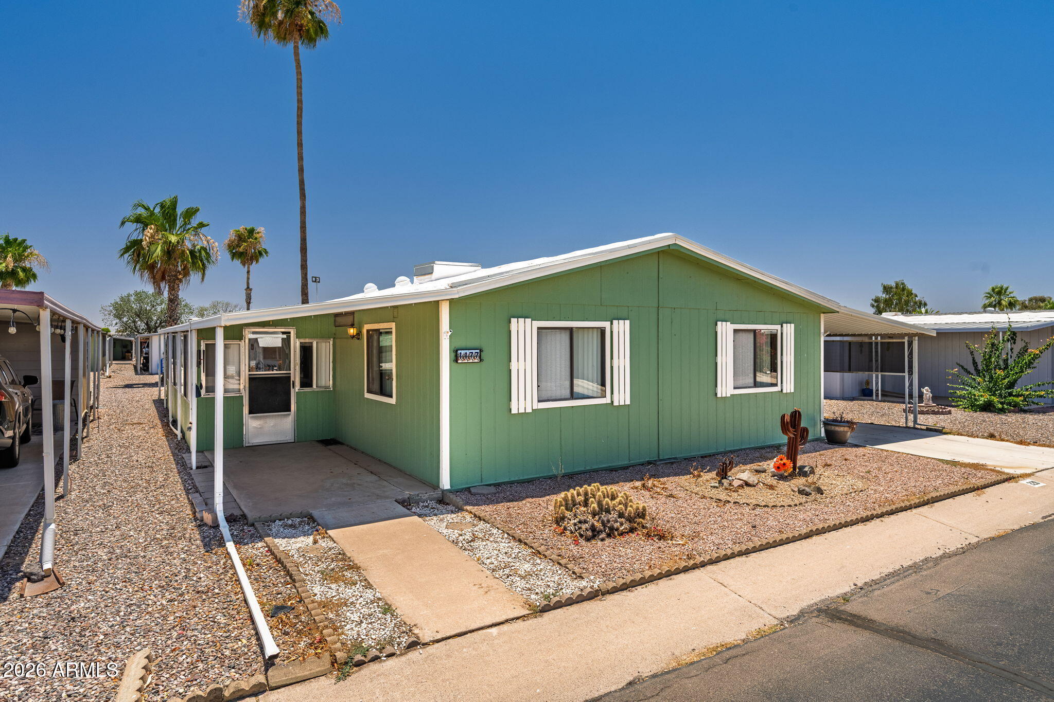 Spacious, open, split floorplan, 3 bed/2 bath home in the sought-after 55+ community of Casa Verde Estates. This 1500 square foot home has an additional bright screened in Arizona room with A/C. There is also a separate large storage room and powered workshop. Large kitchen, built-ins in dining area, and vaulted ceilings. Casa Verde Estates has resort style living available with two swimming pools and spas, pickleball, shuffleboard, billiards, putting green, and more. Monthly planned activities. Located just minutes to the freeway and downtown Casa Grande. Great for permanent residents or a lock-and-leave home. Low monthly lot rent, no HOA. Come see this beautiful home before it's too late!