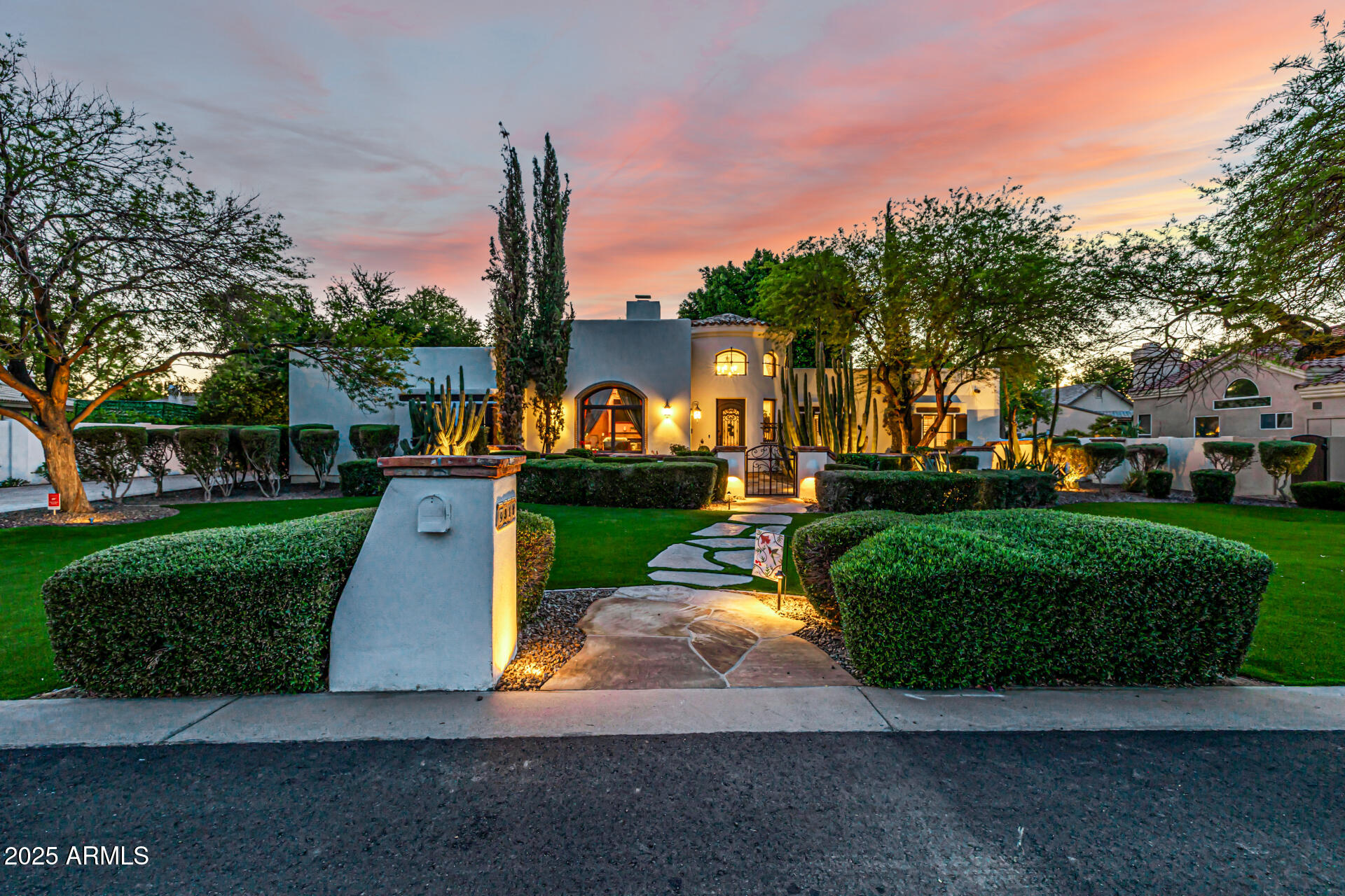 Newly remodeled Santa Barbara-inspired luxury in sought-after Circle G Ranches. This one-of-a-kind custom estate blends timeless Spanish architecture with elevated modern finishes. Enter through a dramatic brick-ceiling rotunda and experience wood-beam ceilings, rich custom millwork, and thoughtfully designed living spaces perfect for everyday living and entertaining. The 5-bedroom floor plan offers a brand-new chef's kitchen, custom butler's pantry, remodeled primary, guest and powder baths, plus a 300+ bottle wine room. The finished basement features a custom bar with live wood-edge bar top, wine fridge, ice maker, beverage fridge, theater sound system, game room, reclaimed barn wood finishes, and craft room. Expansive indoor-outdoor living areas create the perfect Arizona lifestyle