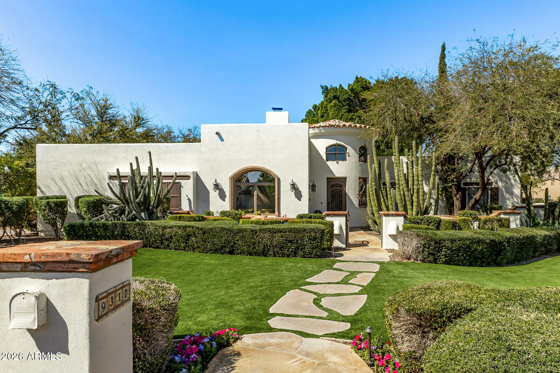 Newly remodeled Santa Barbara-inspired luxury in sought-after Circle G Ranches. This one-of-a-kind custom estate blends timeless Spanish architecture with elevated modern finishes. Enter through a dramatic brick-ceiling rotunda and experience wood-beam ceilings, rich custom millwork, and thoughtfully designed living spaces perfect for everyday living and entertaining. The 5-bedroom floor plan offers a brand-new chef's kitchen, custom butler's pantry, remodeled primary, guest and powder baths, plus a 300+ bottle wine room. The finished basement features a custom bar with live wood-edge bar top, wine fridge, ice maker, beverage fridge, theater sound system, game room, reclaimed barn wood finishes, and craft room. Expansive indoor-outdoor living areas create the perfect Arizona lifestyle