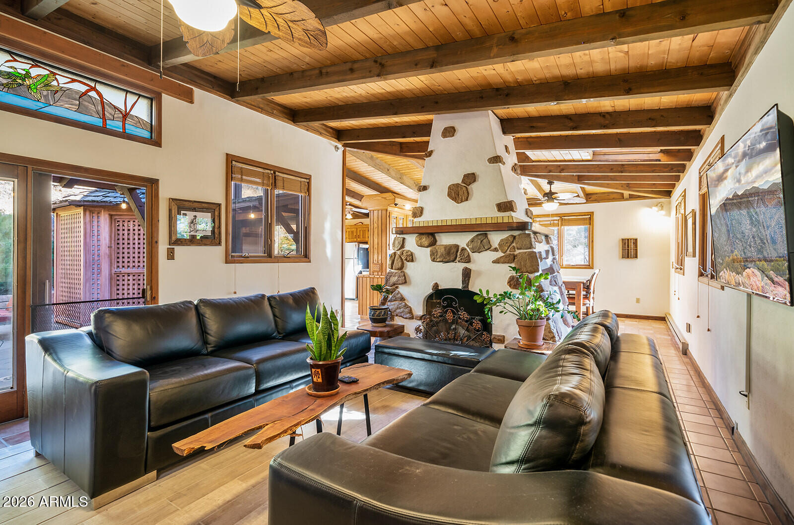 4 bedroom fully furnished custom home, hidden on the best street in Old Bisbee. Pella Windows/Doors, AC, 5 skylights, private courtyard, double sided gas fireplace, exposed wood beams/ceilings, mature landscaping. Solid concrete LEVEL foundation, no stairs or hills to the property and ample free PARKING! (all a rarity in Bisbee) Approx. $30,000 of new furnishings, artwork, 5 smart TV's, beds/bedding, fully appointed kitchen, large and small appliances, regulation size pool table. All you need are your clothes and a toothbrush. This turnkey home or currently fully permitted Airbnb has produced $133,150 (average of $5,547 per month) in sales over the last 24 months. Live in it, rent it, Airbnb it, or a combination thereof. 12000 sqft (+/-) lot twice the size of the average Bisbee lot!
