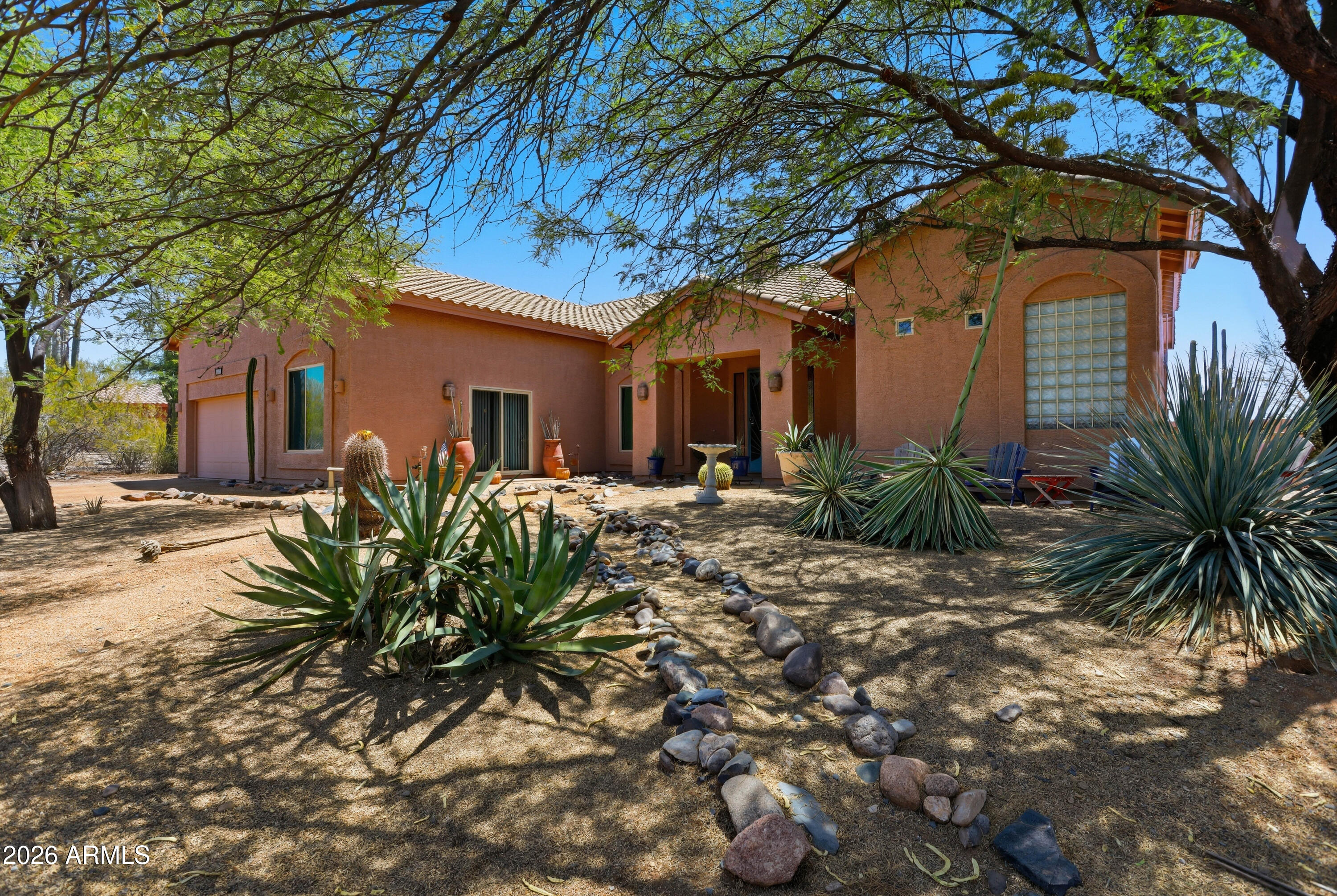 Set atop 3.85 acres in coveted North Cave Creek Red Dog Ranch, this unique and extraordinary desert 1 story 3,300 sq ft retreat captures endless mountain vistas, unforgettable sunsets, and star-filled night skies. Thoughtfully designed with a unique split floor plan, the home offers 4 bdrms, 3 ba -- (2 have been newly remodeled 2025), plus a versatile bonus room with private entrance--perfect as a guest retreat, office, studio, or fitness space total of 10 rooms! 

Inside, expansive living spaces and a gourmet kitchen flow effortlessly beneath new 2014 Lifetime windows throughout, framing the breathtaking beauty of the surrounding desert at every turn. The luxurious primary suite is a private sanctuary featuring a peaceful sitting area, dual walk-in closets, and a spa-inspired bath. No worries, a newer roof 2015 w/ warranty and added insulation was done!

Step outside to your own resort-style oasis where a sparkling 30 x 16 ft executive salt water lap pool with beach front walk in and large spa, glowing outdoor fireplace, elegant travertine patio tiles, and built-in cooking center invite unforgettable evenings under the open sky. 

The rare gem of this property is an added side lot creating a unique 2-lot estate totaling approx. 3.85 acres--offering endless possibilities for a future casita, RV garage, custom build, or simply preserving the serenity and privacy. As the sun sets, the desert transforms into pure magic as countless stars illuminate the evening sky.