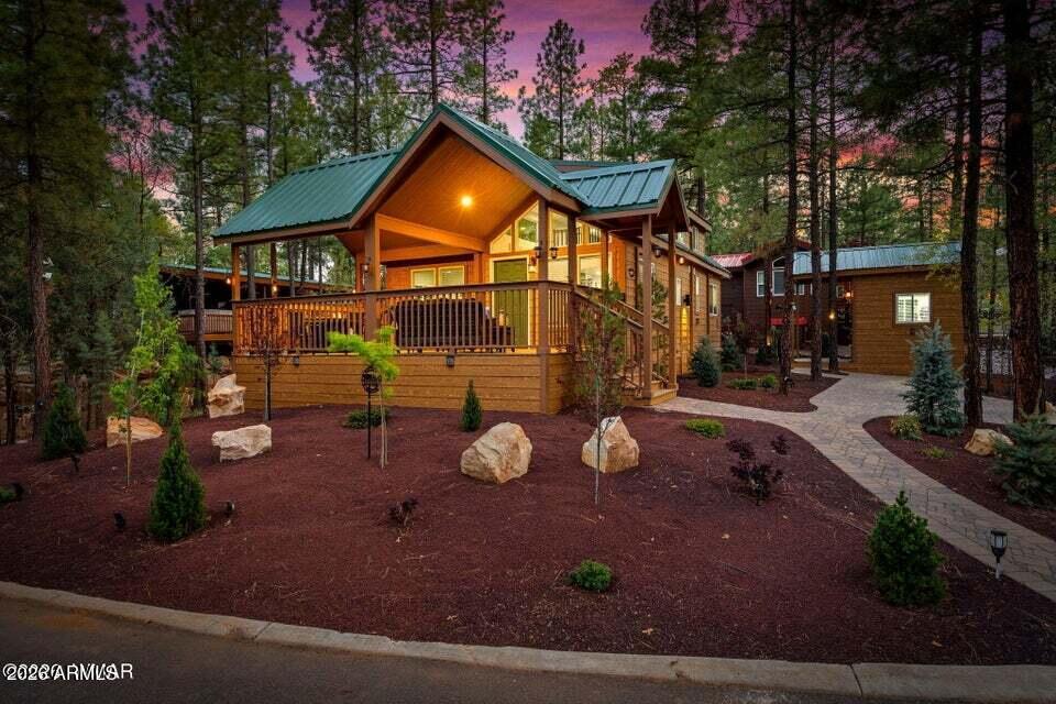 Featuring a NEW build with 2 true bedrooms and 2 bathrooms, plus a versatile loft for extra sleeping, office space, or storage, this home stands out from the rest! An added living room creates even more space to relax and entertain, while the large covered deck invites you to enjoy the cool mountain air year-round. The home has a tankless hot water heater to ensure efficiency and endless hot water. The beautifully landscaped yard enhances the curb appeal and provides a peaceful outdoor setting among the tall pines. A convenient shed with laundry adds functionality. Whether you're looking for a full-time retreat or a seasonal getaway, this property is move-in ready and designed for easy mountain living.