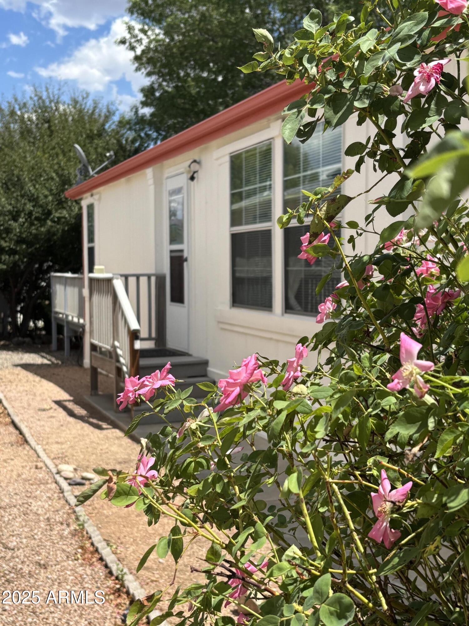 Now Vacant, Motivated seller. Nice 3 bd 2 bath home in a 55 and up community. This home includes an additional den with built-in desk and storage, which opens to a workshop and storage area on one end, and to the back yard on the other. New carpet, 2 year old electric range, 2 year old dishwasher, new refrigerator, exterior paint done 2 years ago, new roof in 2019, new single car garage. Lovely elevated trex deck off the master bedroom overlooking the back yard. The front landscaping has additional parking areas and vinyl grass. This split floor plan has walk-in closets in all bedrooms. The master bath was updated with granite counter, a jetted walk-in tub, and vinyl plank flooring. The active Clubhouse includes billiard room, wood shop, pool, card rooms, laundry and dog park.