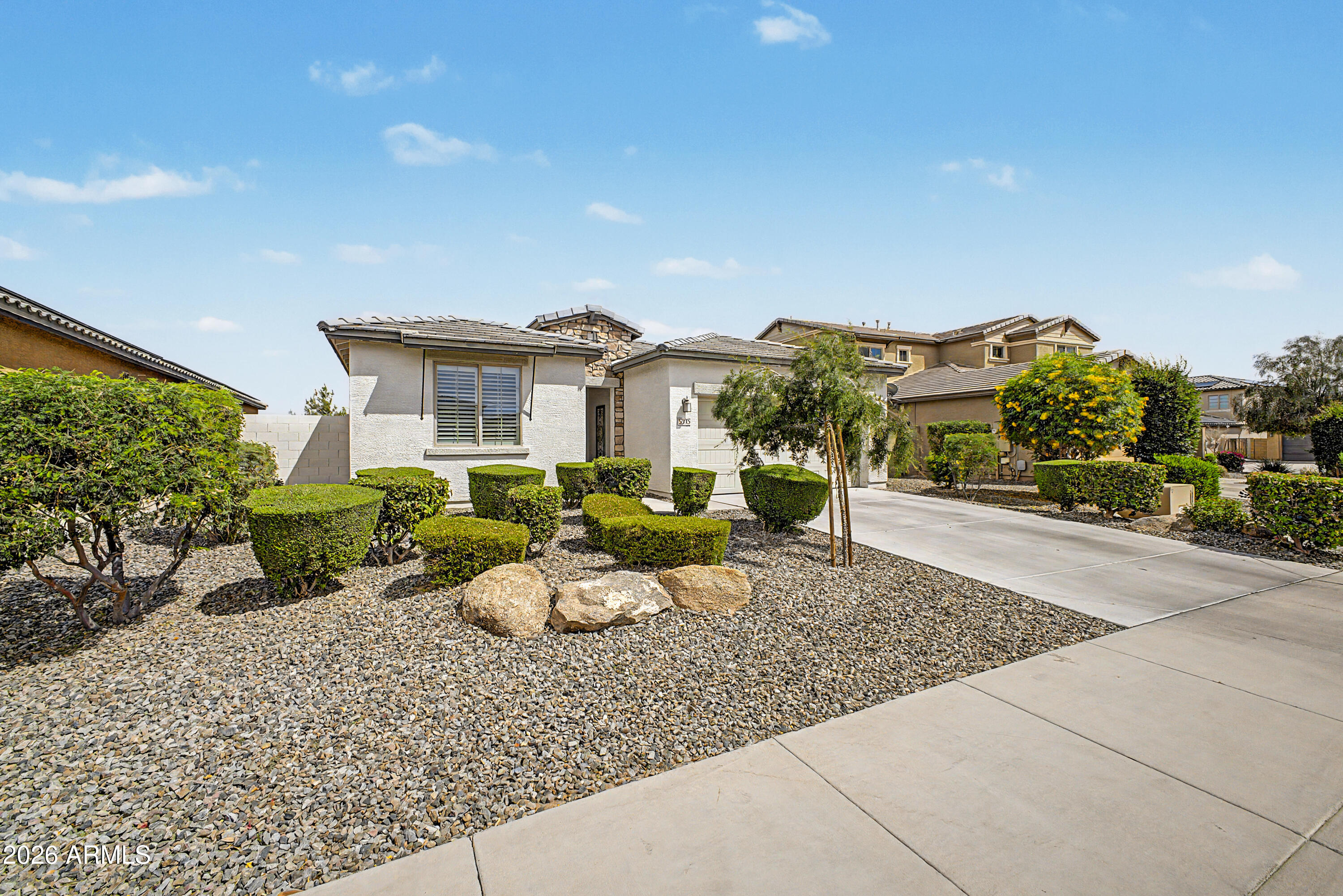 Welcome to this beautifully upgraded home in the highly desirable community of Litchfield Park--where comfort, style, and functionality come together in a truly move-in-ready package. From the moment you arrive, you'll notice the pride of ownership and attention to detail that sets this property apart. Step inside to discover a thoughtfully updated interior featuring modern flooring throughout, complemented by upgraded cabinetry and stunning countertops that enhance both the kitchen and living spaces. The open-concept layout creates a seamless flow, for both everyday living and entertaining. Natural light pours in through plantation shutters, adding warmth and elegance while offering privacy and energy efficiency. The kitchen is a true centerpiece of the home, and the metallic epoxy garage The kitchen is a true centerpiece of the home, designed with both style and practicality in mind. Ample cabinet space, sleek finishes, reverse osmosis, soft water system and quality upgrades make it perfect for preparing meals or gathering with family and friends. Every detail has been carefully considered to provide a modern yet inviting atmosphere. The upgrades continue throughout the home, including electric blinds that offer convenience at the touch of a button and contribute to the home's contemporary feel. Energy efficiency is a major highlight, with fully paid-off solar providing long-term savings and sustainability--an increasingly valuable feature for Arizona homeowners. Step outside into your own private backyard oasis, where relaxation and entertainment await. The low-maintenance synthetic grass ensures year-round greenery without the upkeep, while the pergola provides shaded comfort for outdoor lounging. Enjoy evenings by the gas fire pit or host unforgettable gatherings with the built-in grill--perfect for Arizona's outdoor lifestyle. One of the standout features of this property is its elevated positioning, offering beautiful views of nearby parks and open spaces. Whether you're enjoying your morning coffee or winding down at sunset, the scenery adds an extra layer of tranquility and charm. Car enthusiasts and hobbyists will appreciate the garage, which features a stunning metallic epoxy floor--both durable and visually striking. This space is as functional as it is impressive, offering a clean and polished look that elevates the entire home. Located in the heart of Litchfield Park, this home offers convenient access to local parks, walking paths, golf courses, shopping, dining, and top-rated amenities. The community is known for its charm, tree-lined streets, and welcoming atmosphere, making it a sought-after destination for homeowners looking for both convenience and quality of life. With too many upgrades to list, this home truly needs to be seen in person to be fully appreciated. Every inch has been thoughtfully designed and upgraded to provide comfort, efficiency, and style. Wired and plumbed for hot tub on pad out back.Don't miss your opportunity to own this exceptional home--schedule your private showing today and experience everything it has to offer.