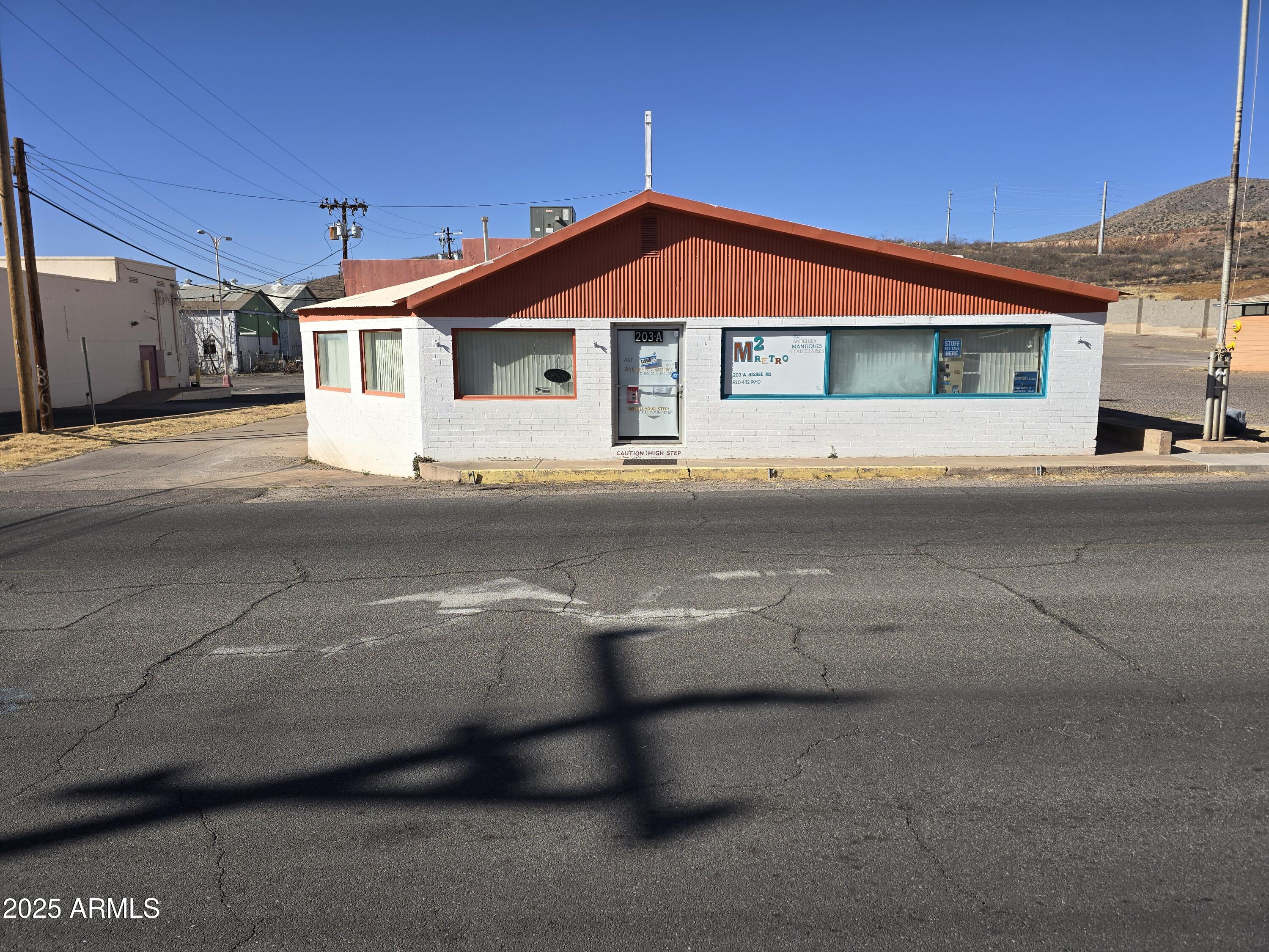 Multi use building was last open as a retail store. Your imagination is your limits, 4864 Sq Ft that can be used in many ways. Mid area has large 20 foot wide garage door for access. Back area can be used as a 2 bedroom apartment. Has public restroom for common area and Full bathroom for Back area. Heat and A/C , hot water heater.  Owner is a Real estate Broker.
