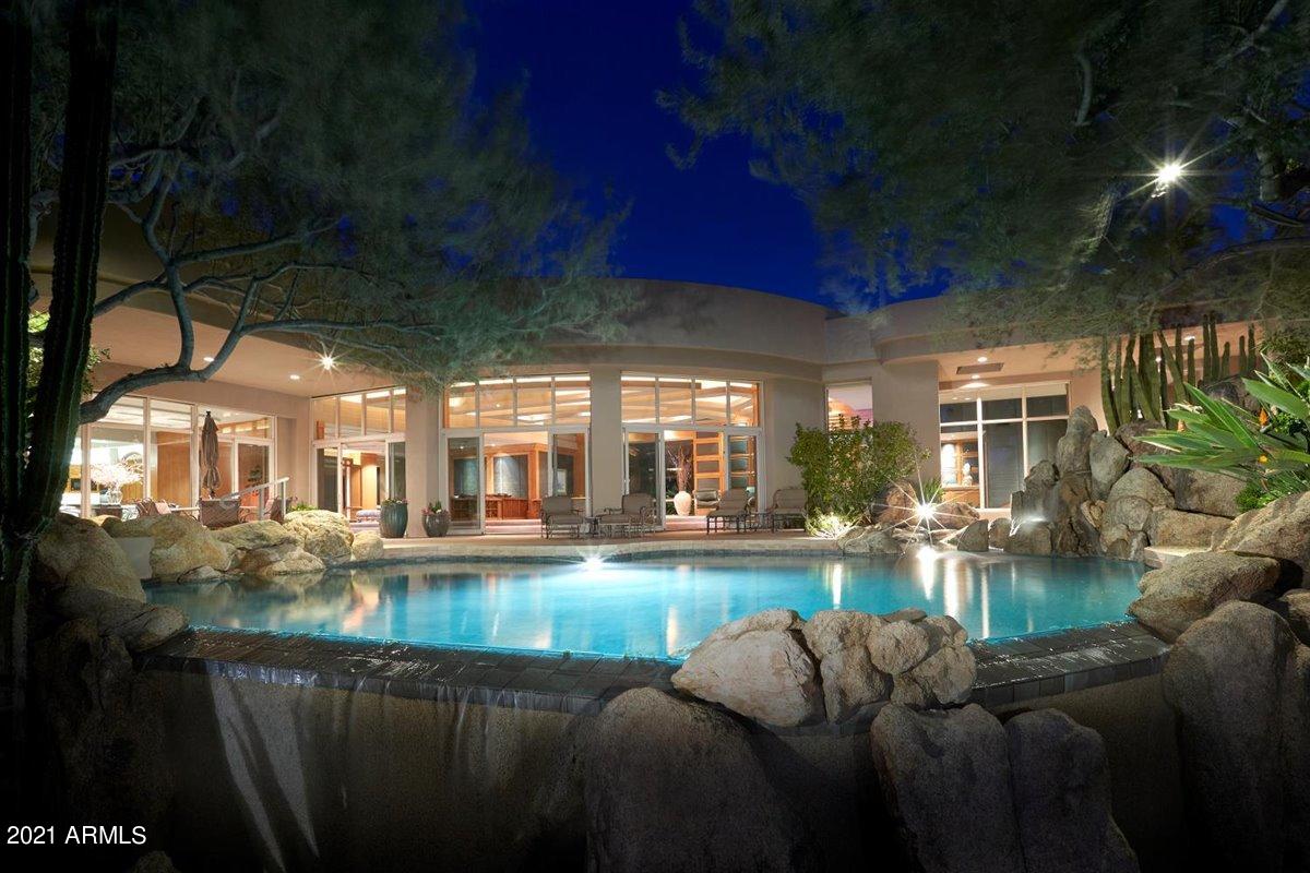Bringing generations together under one roof, this unique estate home is all encompassing, situated on 3 lots, spanning approximately 460 feet of golf course frontage within the pristine sonoran desert. This grand estate is the perfect family retreat offering private indoor/outdoor living spaces, spanning over 9,000 square feet.   This amenity-rich home offers formal living room, large dining room, spacious family room with wet-bar, adjacent to the kitchen.  Secluded master suite, office and 4 guest bedrooms with ensuite bathrooms.  Private gardens and outdoor living with heated pebble tec pool and spa, cascading water features, covered terraces, built-in barbecue, firepit and sweeping mountain views. The legal description is 661 lot assemblage, physical address and home sit on Lot 663.Desert Highlands world class amenities include a Jack Nicklaus championship golf course, 18-hole putting course, award winning clubhouse featuring ''Jack's'' gastropub, remodeled and state of the art fitness center, Highlands Racquet Club featuring grass and clay tennis courts + pickleball courts & more.  A $75,000 membership fee is due from buyer at close of escrow.
