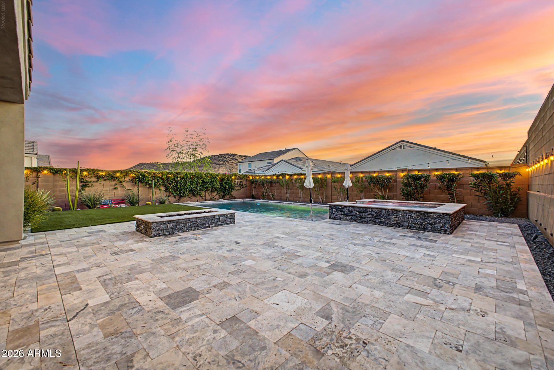 Located in a private GATED community, this home checks all the boxes. Inside you'll find an open floor plan with a stunning modern kitchen featuring gas appliances, beautiful wood-look tile flooring, updated lighting throughout, and a primary bathroom with a custom walk-in shower that steals the show. Out back is where this home really shines with a covered patio, upgraded travertine decking, a heated pool and spa, gas fire pit, and a turf area that's perfect for kids or dogs to play. Add in a 3-car tandem garage, fully PAID OFF OWNED SOLAR panels to help keep utility bills down, a full Ring security camera system, and incredible mountain views, and you've got a home that's hard to beat!