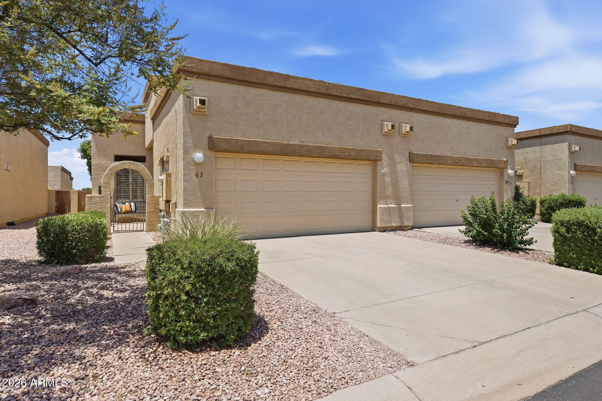 Beautifully maintained 3BR/2BA townhome in the gated Vista Villa all-age community with pool and spa. Features an open floor plan with 10ft ceilings throughout, abundant natural light with 3 skylights, tile flooring throughout, new carpet in the guest bedroom, and luxury vinyl plank flooring in the primary bedroom. Spacious primary suite includes a walk-in closet with built-ins and large walk-in shower. Additional updates include a newer A/C, water heater and roof. Enjoy the eat-in kitchen, private covered patio, fenced yard, and front courtyard. Light, bright, and move-in ready! HOA covers exterior maintenance, roof repair and replacement, blanket insurance policy,