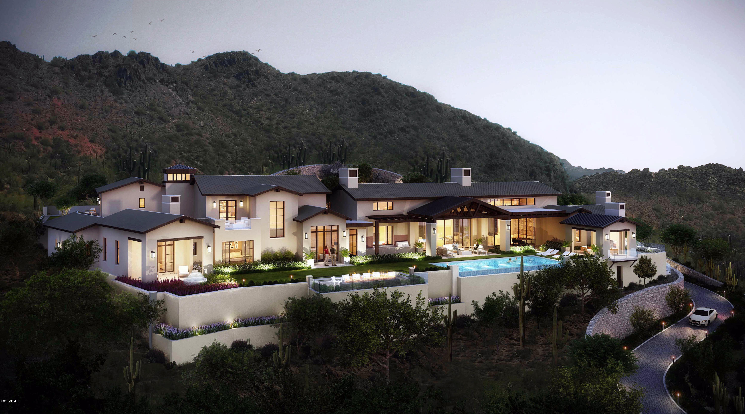 Absolutely Stunning New Custom Home on one of the most secluded & private Lots in Silverleaf Upper Canyon.  This 3.98 acre estate with a huge acre plus building envelope has panoramic views of the McDowell Mountain Preserve and fantastic city light views to the southwest. Exquisitely designed Modern Ranch masterpiece has been created by a collaboration between PHX Architecture and Sommer Custom Homes.  The home's architecture is infused with sleek clean lines, walls of glass, metal trusses & pergolas, light filled rooms, and luxurious finishes. 6-car oversized Garage space, Guest House w/ bedroom, sitting room, full bath and separate entrance but attached with lockable access to main house and includes fireplace, coffee bar, and covered patios front and rear. The fantastic views are aligned with the front door entry and look through the foyer and Great Room with a retractable wall of glass and offer a large expansive feel. When the doors are opened the space expands and spills out onto the covered patio and overlooks the huge zero edge pool and separate zero edge spa.  An inviting Pool Cabana awaits with a two-way fireplace & TV and on the other end of the pool a there is a spacious fire pit with seating area.
Huge Rec Room downstairs with retractable walls of glass on both sides of the room opening up to patios front and rear for more entertainment space with a full wetbar and 2nd powder bath (serves as a pool bath too). 
Large Kitchen filled with natural light and top of the line appliances with walls of windows on each side.
Luxurious Master Suite secluded on the far end of the home opens up to a private courtyard with a built in heated spa. The Master bedroom includes a covered patio with sweeping city light and mountain views. 
Large Dining Room overlooking the backyard and has a glass enclosed Wine Room wall at one end. 
Office with closet and full bath overlooks the rear yard for amazing views as well.
Large dedicated AV Room off Rec Room.
An elevator plus a grand staircase takes you to the upper level with a 31x25 Bonus Room, rear view deck,  two large bedroom suites with a private lawn and patio area also accessible by an exterior staircase to the garage courtyard, an exercise room with a closet & full bath, and laundry area off of upper hallway. 
Extensive use of wide plank European White Oak wood flooring. Expansive windows opening up the views throughout.
Office and Exercise rooms have closets and full bathrooms and count as the 5th and 6th bedroom if needed.
Still time to choose all interior finishes and put your signature on this amazing creation.
Estimated completion is end of September 2021.