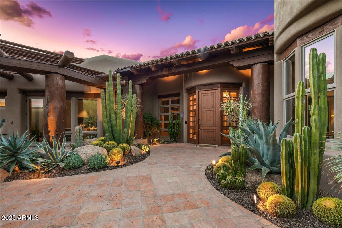 Stunning Southwest-Style Retreat in Desert Mountain with GOLF MEMBERSHIP AVAILABLE. Experience the best of Desert Mountain living in this beautifully updated Southwest-inspired home perfectly positioned on the 18th hole of Desert Mountain's Chiricahua Golf Course.  Capture dramatic golf course and mountain views in your own private and quiet back yard resort.  Warm natural finishes, timeless architectural details, and thoughtful modern updates create a seamless blend of comfort and luxury. The fully automated smart home features an updated Lutron/Control4 system and automated controls for lighting, shades, security system, door locks, entire house sound system, HVAC and water system monitoring.  An open, light-filled great room anchors the home, featuring beam-accented ceilings, a statement fireplace, and expansive windows framing sweeping fairway and high-desert vistas. The updated chef's kitchen offers premium appliances, rich cabinetry, and generous workspace for effortless entertaining. The spacious primary suite provides a serene escape with striking views and a spa-style bath. Guest suites are privately situated, offering comfort for family and friends. Indoor/outdoor living shines with multiple patios, large covered lounging spaces, and an elevated setting ideal for sunsets and stargazing. This residence includes the opportunity for a Golf Membership (subject to club approval), providing access to Desert Mountain's world-class golf, dining, fitness, and amenities. A perfect blend of style, setting, and lifestyle, this Desert Mountain home is ready to enjoy. The home was purchased in October 2020 from the original owners and some major improvements since that time include: Complete replacement of all 5 HVAC systems with top-of-the-line Carrier units,  2 new 85 gallon lifetime Marathon water heaters, new water softener system, roof refinish, full exterior and interior repaint and stain, new updated home automation systems/controls, new electronic shades, new speakers throughout, new electrical switches, outlets and screwless plates throughout, new home theater projector, full house window tint with UV-blocking film, new pool equipment, new hot-tub and pool tile, new wood flooring throughout, all stone, grout and tile resealed, new landscaping and sprinkler system, completely refinished laundry room with 2 sets of washers and dryers, new custom golf storage garage closet. The house looks and feels brand new - A MUST SEE!!