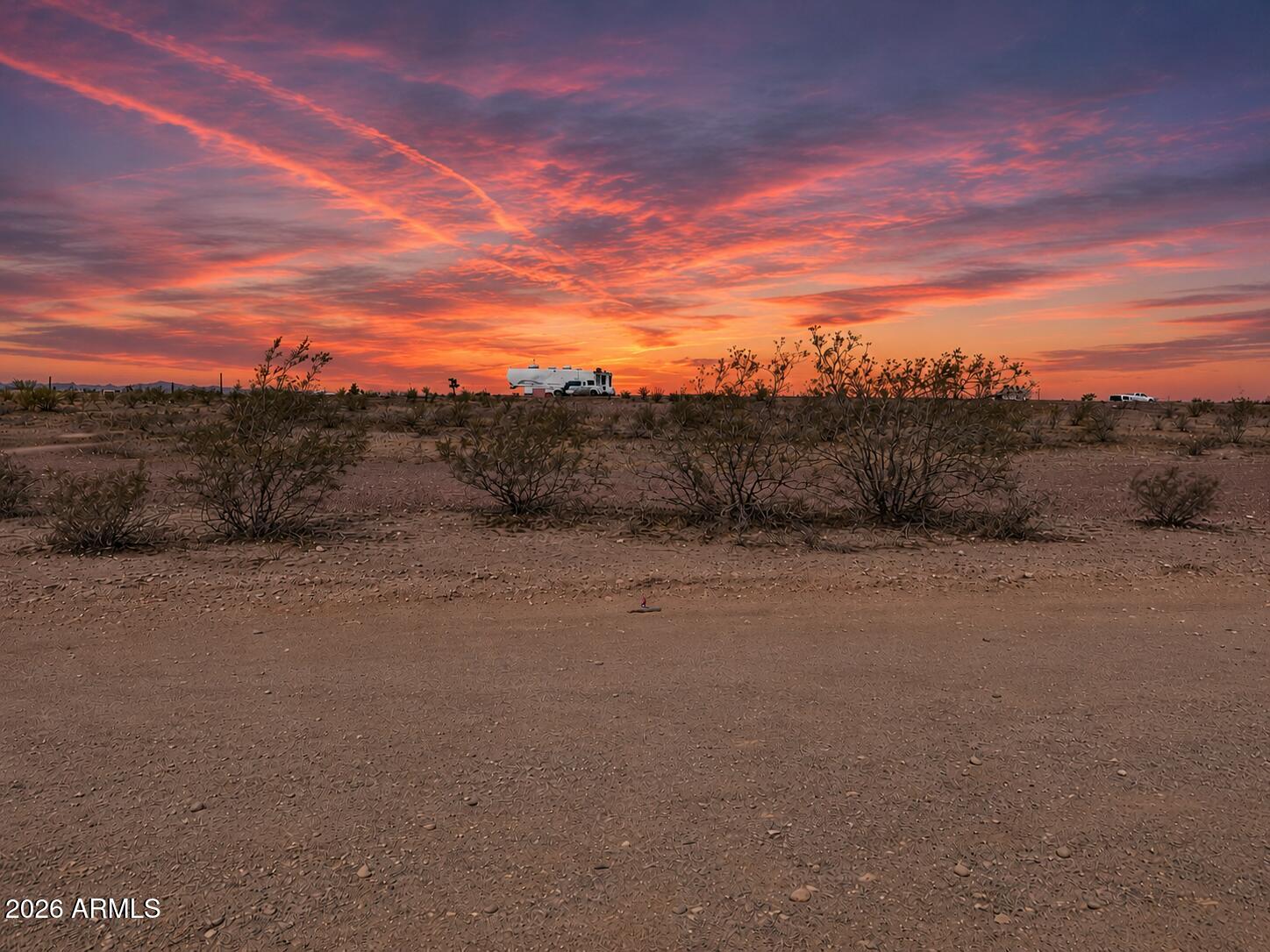 Drive By Only, Easy-access to this 4.086 acre parcel, Escape to wide-open Arizona living with this beautiful desert parcel in Wittmann's Whispering Ranch area, offering breathtaking panoramic mountain and desert views, stunning sunsets, and peaceful privacy. Ideal for a custom home, manufactured home, ranch setup, off-grid retreat, or recreational getaway. Enjoy this landscaped with gravel roads, ready to use land with plenty of room for horses, toys, RVs, or future development. With existing corrals for your horses & surrounded by natural desert landscape, dark skies, and expansive open space while still offering access to growing West Valley opportunities. A rare chance to own acreage where you can create your dream desert escape with room to breathe and endless possibilities.