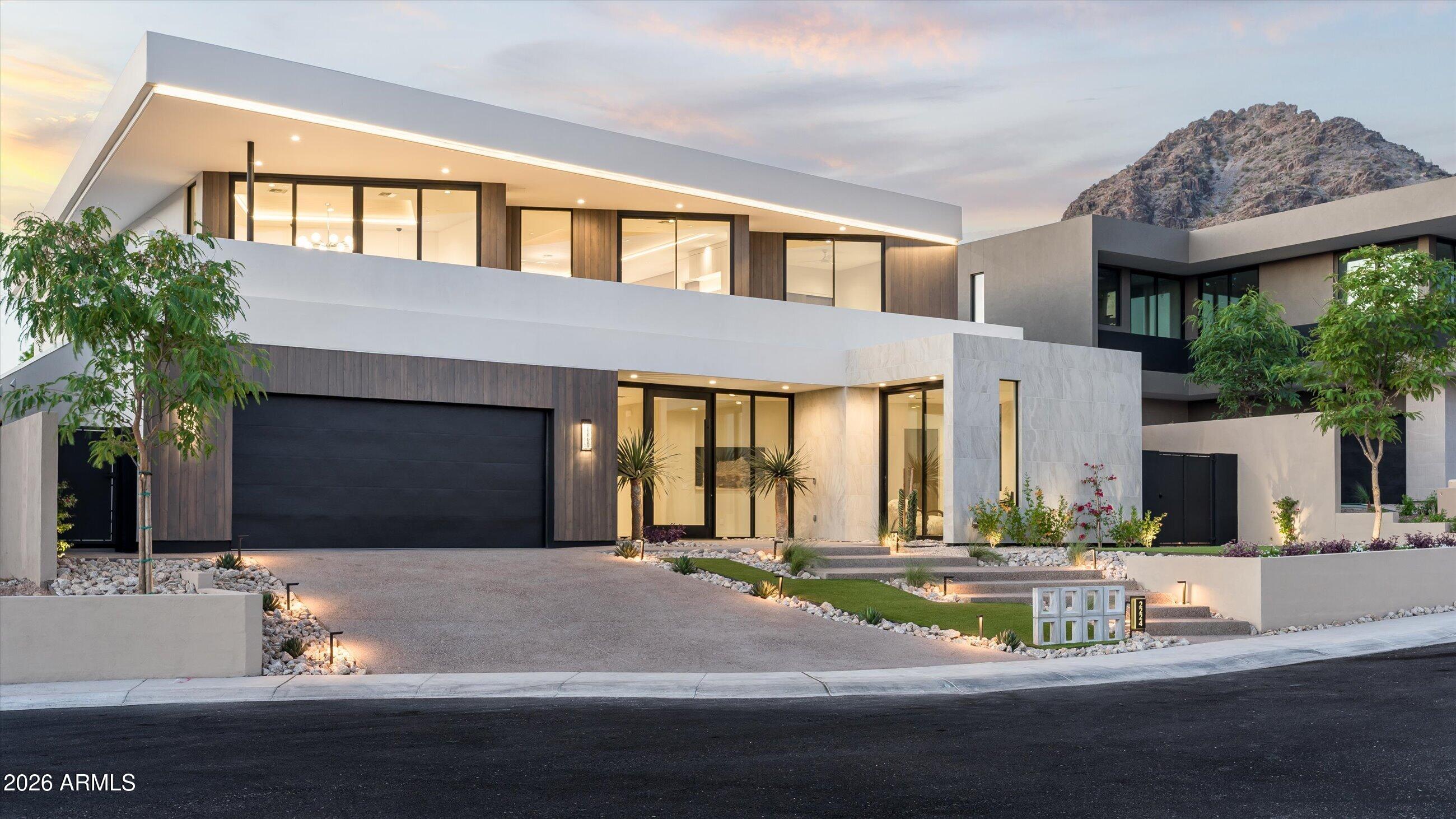 Introducing the first release at 7 Views, an exclusive boutique community ideally positioned near Piestewa Peak with sweeping mountain and city light views, designed for those seeking elevated architecture, refined finishes, and exceptional proximity to the best of Phoenix. This brand-new 2026 construction residence offers approximately 4,937 square feet with 5 bedrooms and 4.5 bathrooms, including four en-suite bedrooms designed for both privacy and comfort. Thoughtfully crafted for modern living and effortless entertaining, the home blends dramatic scale with warm, livable design At the center of the home is a stunning chef's kitchen featuring a premium Wolf/Sub-Zero appliance package, expansive entertaining island, and seamless connection to the great room highlighted by soaring 22-foot ceilings and walls of glass framing the surrounding views. A fully equipped back kitchen with additional refrigeration, sink, and dishwasher adds both convenience and functionality.
Additional features include a sophisticated wet bar, temperature-controlled wine display, upstairs family lounge with secondary wet bar, and a spacious 4-car garage with EV charging capability.
Designed to embrace Arizona indoor-outdoor living, the residence offers an ideal balance of luxury, comfort, and lock-and-leave convenience within one of Central Phoenix's most connected locations.
Situated just minutes from the Arizona Biltmore, Esplanade, Lifetime Biltmore, premier dining, shopping, and entertainment, with immediate access to SR-51 providing seamless connectivity to Downtown Phoenix, Sky Harbor Airport, Mayo Clinic, Banner, and Phoenix Children's Hospital.  USE GOOGLE MAPS ONLY - APPLE TAKES YOU IN WRONG DIRECTION!