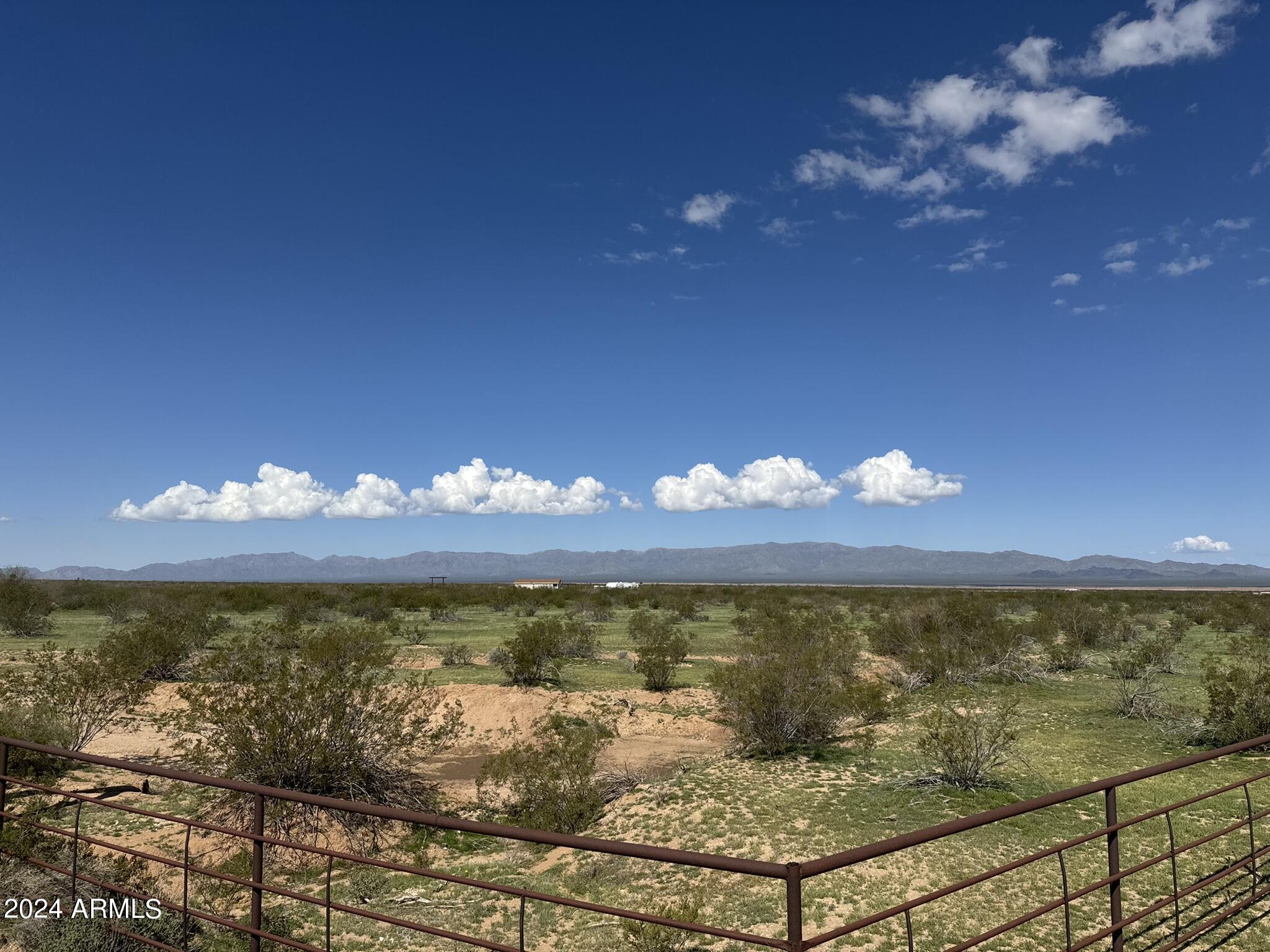 Fantastic opportunity to own a level 5 acres to build your dream home or horse facility. Fully fenced with pipe!! Aguila water company has a water line ran adjacent to the lot. Close to power, easy road access and amazing views!! There are two 5-acre parcels and two 2.5 -acre parcels available for sale. Property will be on the right. Parcel is on the southeast corner.