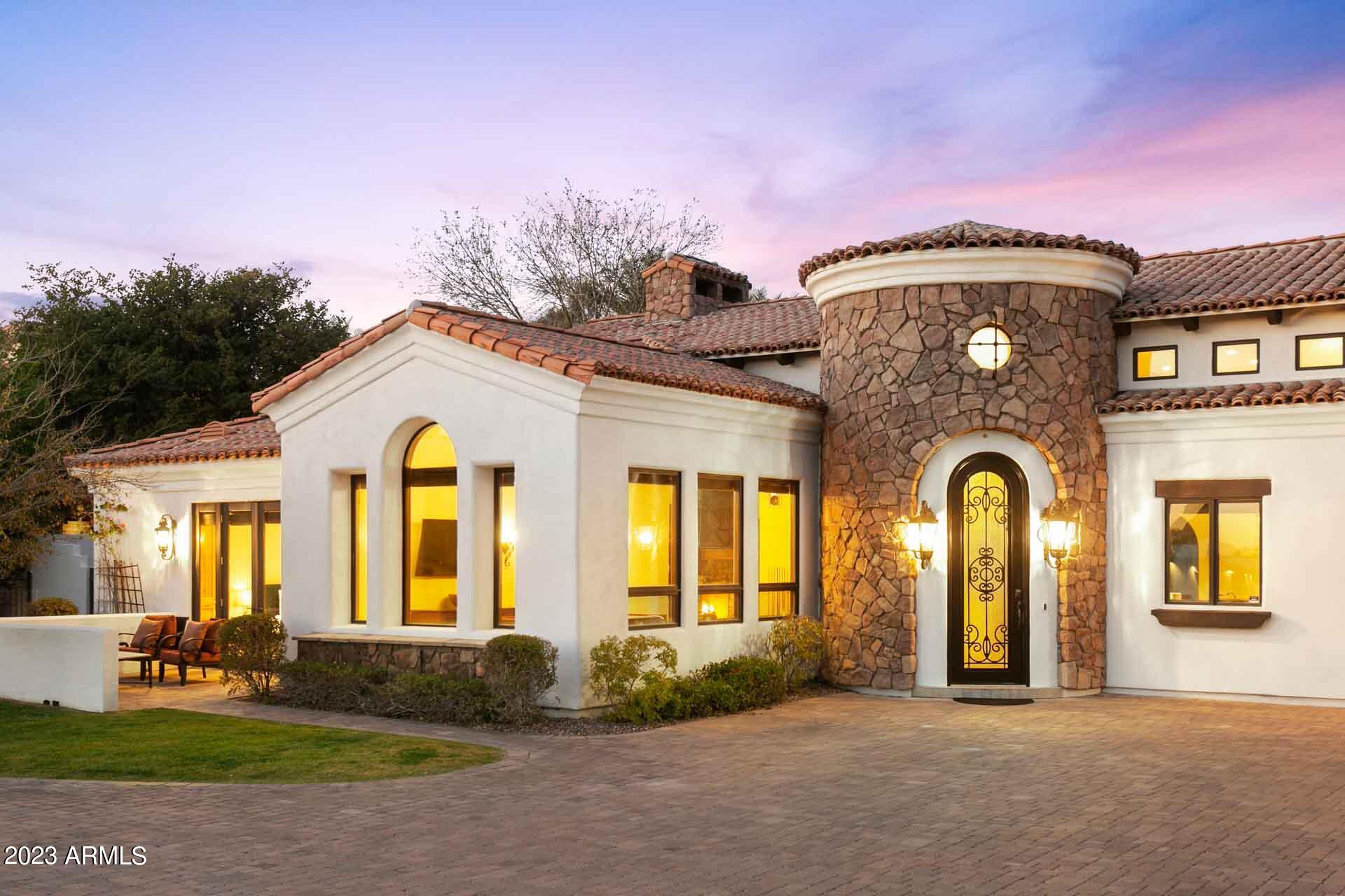 Walk into this Arcadia beauty with soaring ceilings and an open main living area. Past the warm and inviting chef's kitchen, and you'll find yourself in an oasis with a view of Camelback mountain. Entertain your guests with the built in BBQ, heated pool and spa or putting green. Four of the expansive bedrooms are ensuite. Two additional rooms can be catered to your lifestyle, including a separate entrance office or guest room, or a family or game room with a pool entrance. Ride your bike just down the street to Arcadia's beloved restaurants and fitness favorites. This will be a favorite for your family and guests.