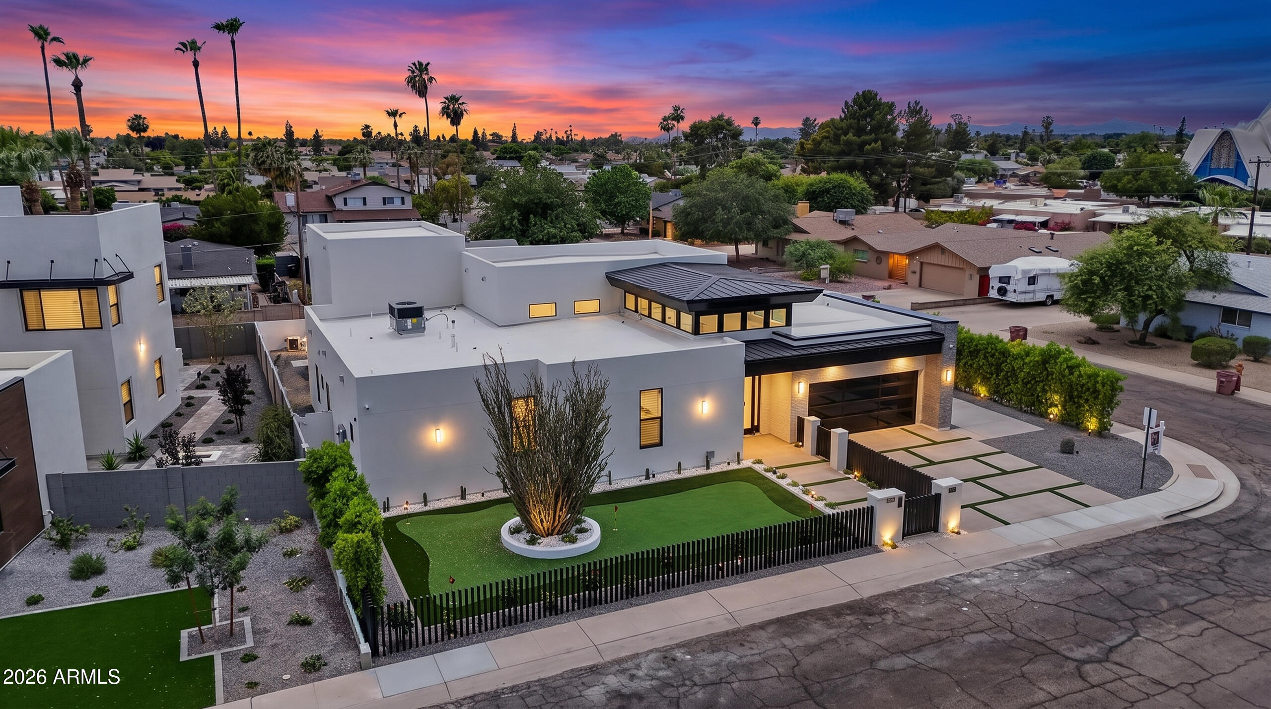 Exceptional 2026 new construction elevating luxury living to an entirely new level. This breathtaking single-level estate offers 6 4, 6.5 bathrooms, soaring ceilings, abundant natural light, and a seamless blend of striking architecture and sophisticated interior design. From the moment you arrive, the home's commanding presence is undeniable. A gated front courtyard welcomes you with an expansive putting green, setting the tone for the extraordinary experience that awaits inside. Step through the grand foyer and discover a residence designed to impress at every turn. The spectacular living room is both elegant and inviting, while the gourmet kitchen is a true showpiece featuring stunning Shonuki cabinetry, a dramatic Taj Mahal quartzite island, Wolf and Sub-Zero appliances, a built-in espresso machine, and a fully equipped chef's kitchen. Designer finishes abound, including a dazzling Cristallo illuminated feature wall surrounding the fireplace and a statement chandelier that is an actual work of art.
The luxurious primary suite is a private retreat with direct access to the backyard, a dramatic Venetian plaster accent wall, and a spa-inspired bathroom that is nothing short of extraordinary. Indulge in a lavish Taj Mahal dual vanity, Cristallo feature wall, glamorous soaking tub, oversized walk-in shower, and custom LED lighting details that create a true five-star experience.

Jaw dropping movie theatre with state of the art technology. In home cinema never looks so cool!

Massive multi-panel sliding doors open to the ultimate indoor-outdoor lifestyle. The resort-style backyard was designed for both relaxation and entertaining, featuring a heated pool and spa partially shaded by a sleek modern pergola, a fully equipped outdoor kitchen, and a cozy firepit gathering area. Completing the outdoor experience is a full one-bedroom guest house topped by an expansive covered observation deck offering breathtaking views of Camelback Mountain and the iconic Praying Monk.

This smart home is loaded with premium features including a private entry gate, Sonos surround sound system, 8 strategically placed security cameras, energy-efficient construction, dual insulated walls, water softener, reverse osmosis system and bidet electric toilets in all bathrooms.

Ideally located in the heart of Scottsdale, this exceptional residence offers quick access to Old Town Scottsdale, Fashion Square, The Biltmore, Kierland Commons, Scottsdale Quarter, and world-renowned resorts including The Phoenician, Royal Palms, and Camelback Inn. Enjoy close proximity to top-rated schools, hiking trails, fine dining, luxury shopping, sports venues, and everything that makes Scottsdale one of the most desirable places to live in Arizona.

A rare opportunity to own a truly remarkable luxury estate where every detail has been thoughtfully curated to deliver an unmatched living experience.