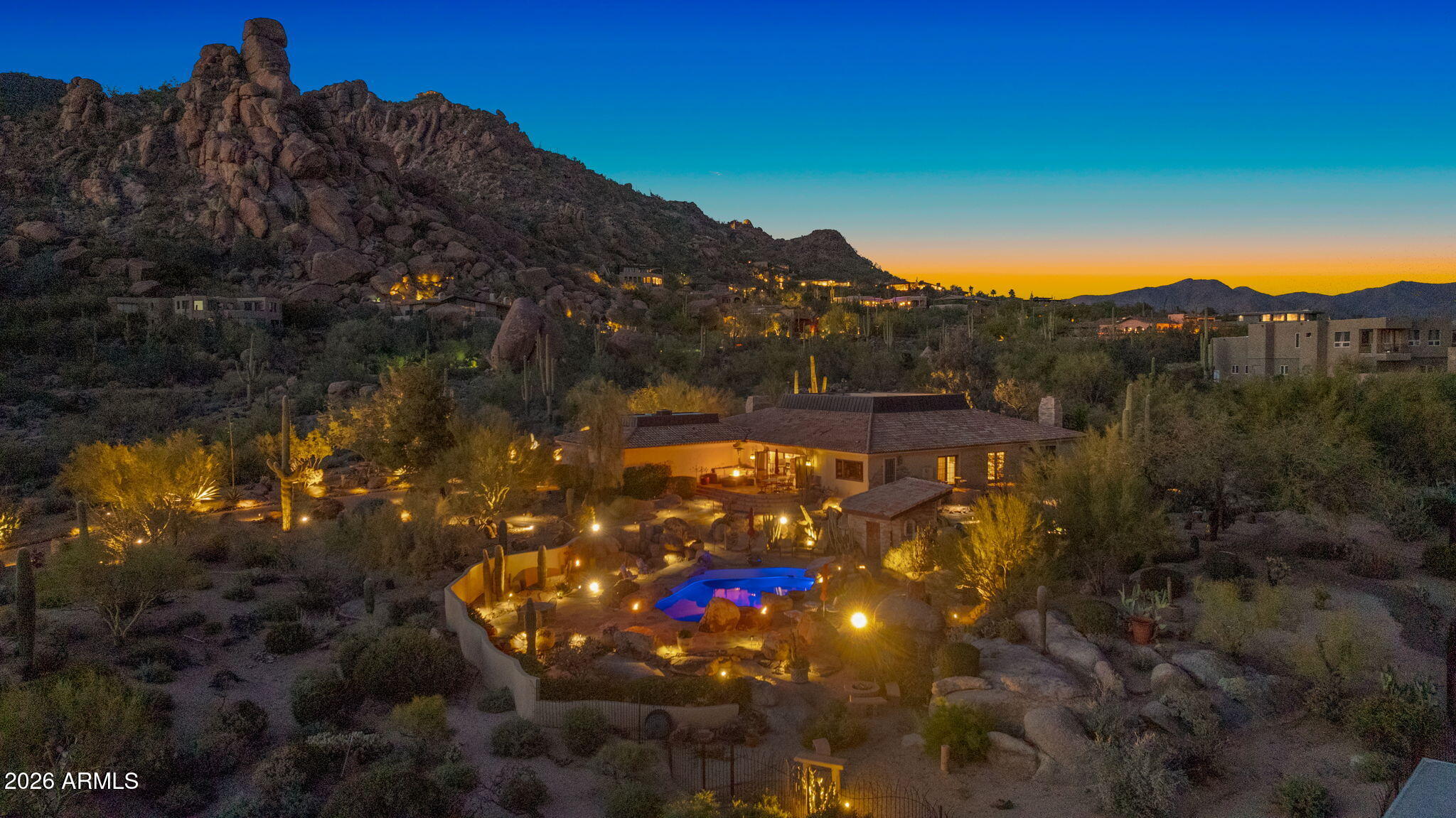 Discover the joy of owning a fully furnished, sophisticated Spanish-style hillside retreat offering breathtaking city lights and mountain views -- including the iconic ''Indian's Toe'' on Black Mountain. Designed for those who appreciate authenticity and craftsmanship, this home captures the true spirit of Arizona living with stone accents, wood-beamed ceilings, hand-carved architectural details, and timeless clawfoot bathtubs.

The chef's kitchen is both stunning and functional, featuring custom handmade cabinetry, a hand-carved petrified wood island with a copper prep sink, a cozy fireplace, and a 48'' Viking Range range. Entertain effortlessly in the game room with a full bar and dedicated wine storage.

Outdoor living is equally exceptional, with multiple patios, a fenced pool fram by natural boulder outcroppings and an outdoor shower, plus a rooftop deck perfect for sunsets and stargazing. This is desert luxury at its finest -- warm, refined, and move-in ready for today's discerning home buyer.

Located just 2 miles from the charming town of Carefree, 2.8 miles from the western town of Cave Creek, and 18 miles from Scottsdale & the 101 Loop/Pima Freeway.