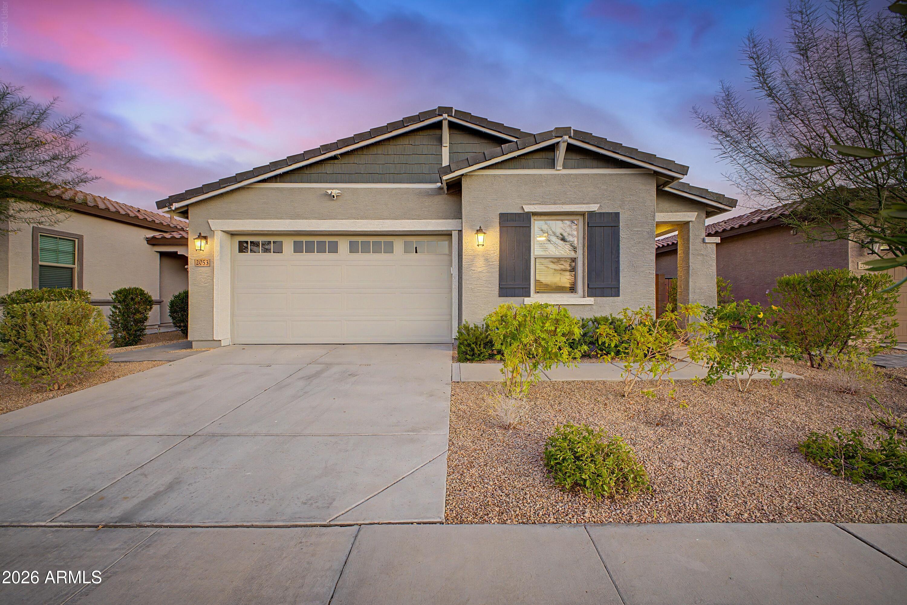 Welcome to Copperleaf at Sonoran Foothills! Built in 2023, this beautifully upgraded single-level home offers 4 bedrooms, 2 bathrooms, and 1,923 square feet of thoughtfully designed living space.

The open-concept floor plan is filled with natural light and centers around a stunning kitchen featuring white shaker cabinetry, stone countertops, designer tile backsplash, Frigidaire Gallery stainless steel appliances, a 5-burner gas cooktop, and an oversized island perfect for entertaining. Just off the main living area, a custom-built bar and wine station adds a unique touch rarely found in homes of this size and price point.

The split floor plan provides privacy, with the spacious primary suite offering dual vanities, a large walk-in closet. Step outside to a professionally finished backyard designed for easy enjoyment, complete with pavers, artificial turf, outdoor lighting, gas stub-outs for a future BBQ or fire feature, and mountain views. The epoxy-coated garage includes overhead storage and a whole-house water filtration system.

Located within the gated Copperleaf community in sought-after Sonoran Foothills, residents enjoy convenient access to shopping, dining, hiking trails, top-rated schools, and major commuter routes. This move-in ready home offers the perfect combination of style, comfort, and functionality in one of North Phoenix's fastest-growing areas.