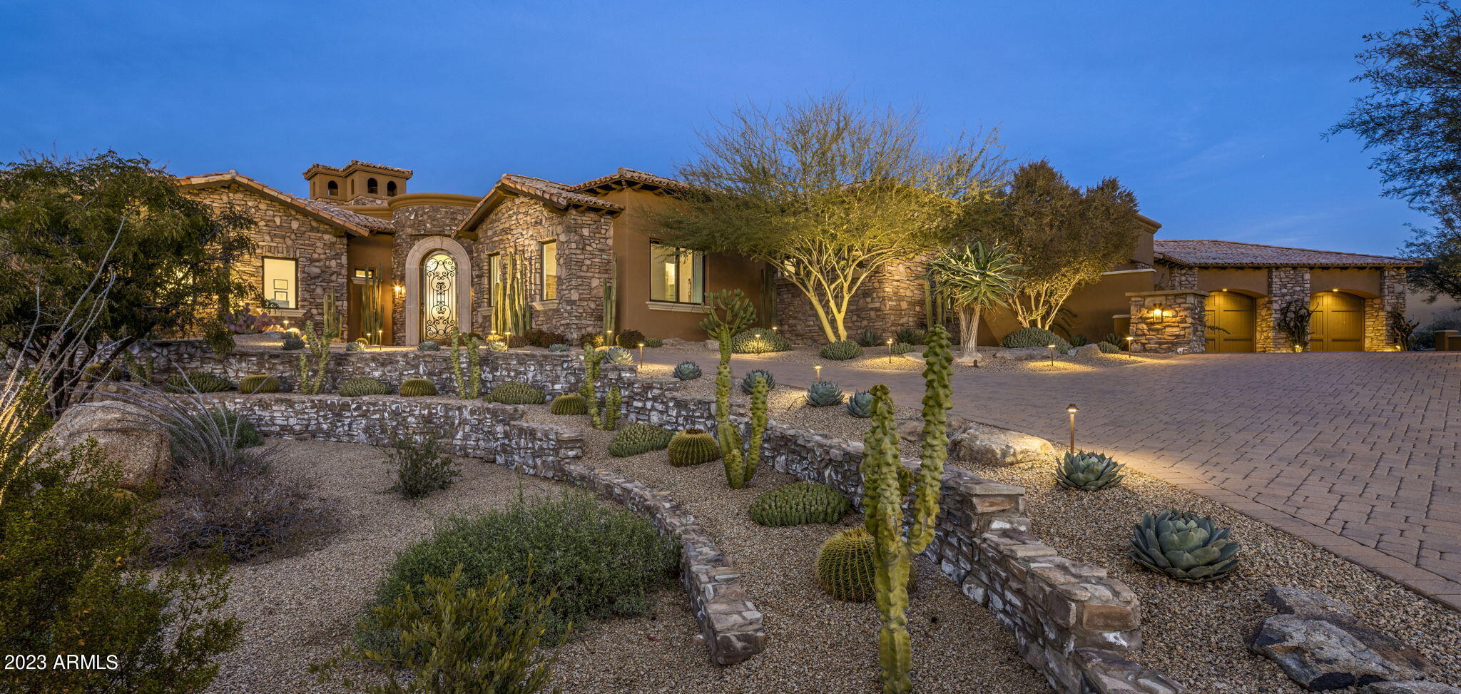 Beautifully updated custom home located in Talus at Troon North. 2015 construction with recent upgrades throughout! Modern transitional interior design with exquisite finishes & attention to detail. Desirable open floor plan with split primary suite and en suite guest rooms. Chef's kitchen w/ gas cooktop that opens to the great room and wet bar, perfect for entertaining. Large master suite w/ dual closets, vanities & water closets. Resort style backyard w/ wrap around tongue and groove covered patio, heated pool & spa, built-in BBQ, fire pit & view deck. Attached casita/game room with direct entry from climate controlled 4 car garage. Please see attached key feature sheet for the detailed list of property upgrades!