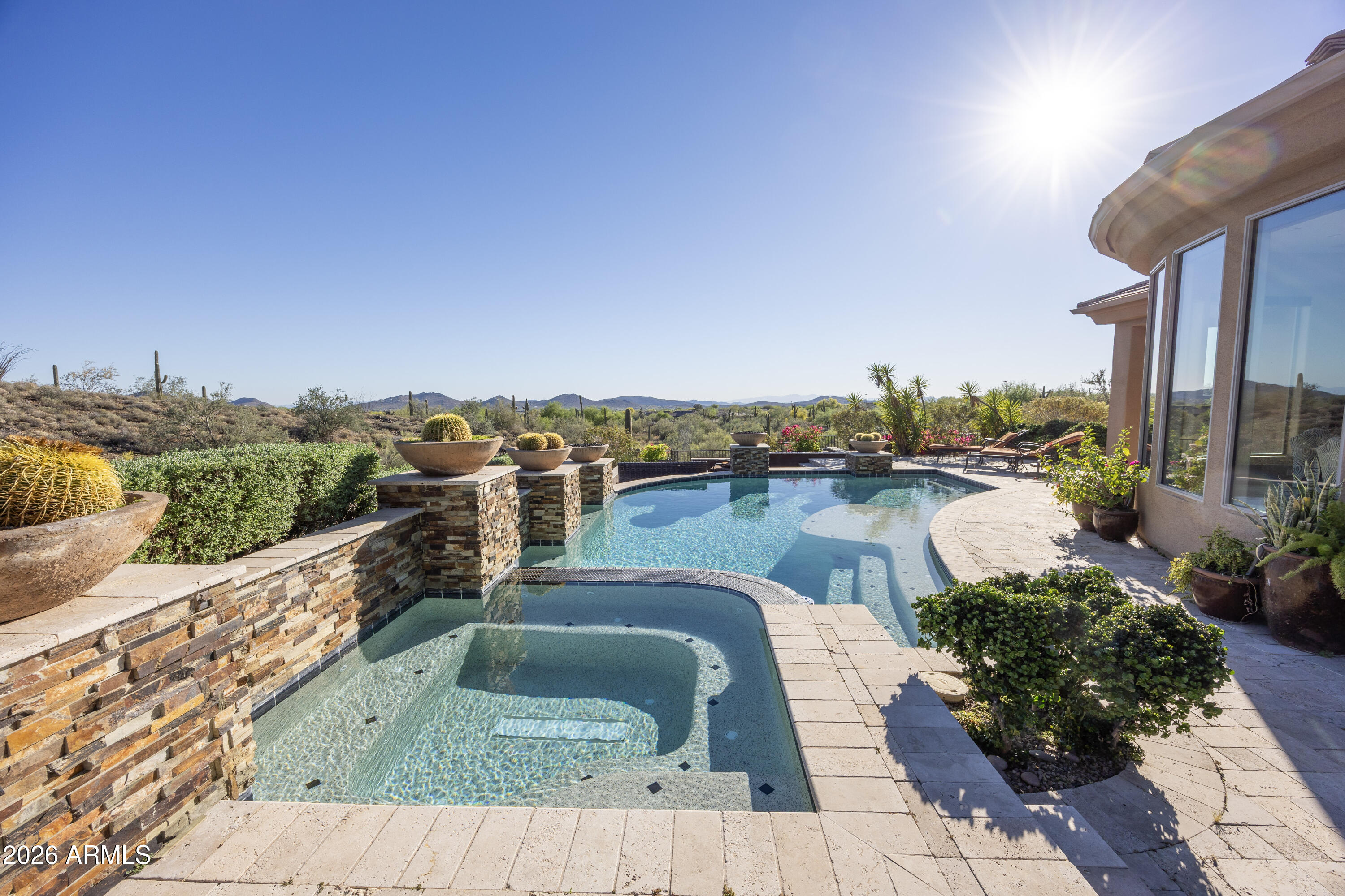 Executive residence featuring Stunning Mountain Views, a Remodeled Floor Plan, Heated Pool and Spa, Dual Master Bedrooms, and an Entertaining Backyard built for Arizona Living at its finest. This exceptional 3-bedroom, Den, 3-1/2-bathroom home delivers a thoughtfully Remodeled Floor Plan with a Granite Kitchen, Kitchen Island with Breakfast Bar, and a Walk-in Shower in each suite. The Dual Master Bedrooms offer rare flexibility for multi-generational living or hosting guests in total comfort. Step outside to the Entertaining Backyard complete with a sparkling Heated Pool and Spa surrounded by breathtaking Stunning Mountain Views. The 3-Car Garage adds convenience, while Anthem Country Club membership elevates the lifestyle with world-class amenities including Golf, Pickleball and Fitness.