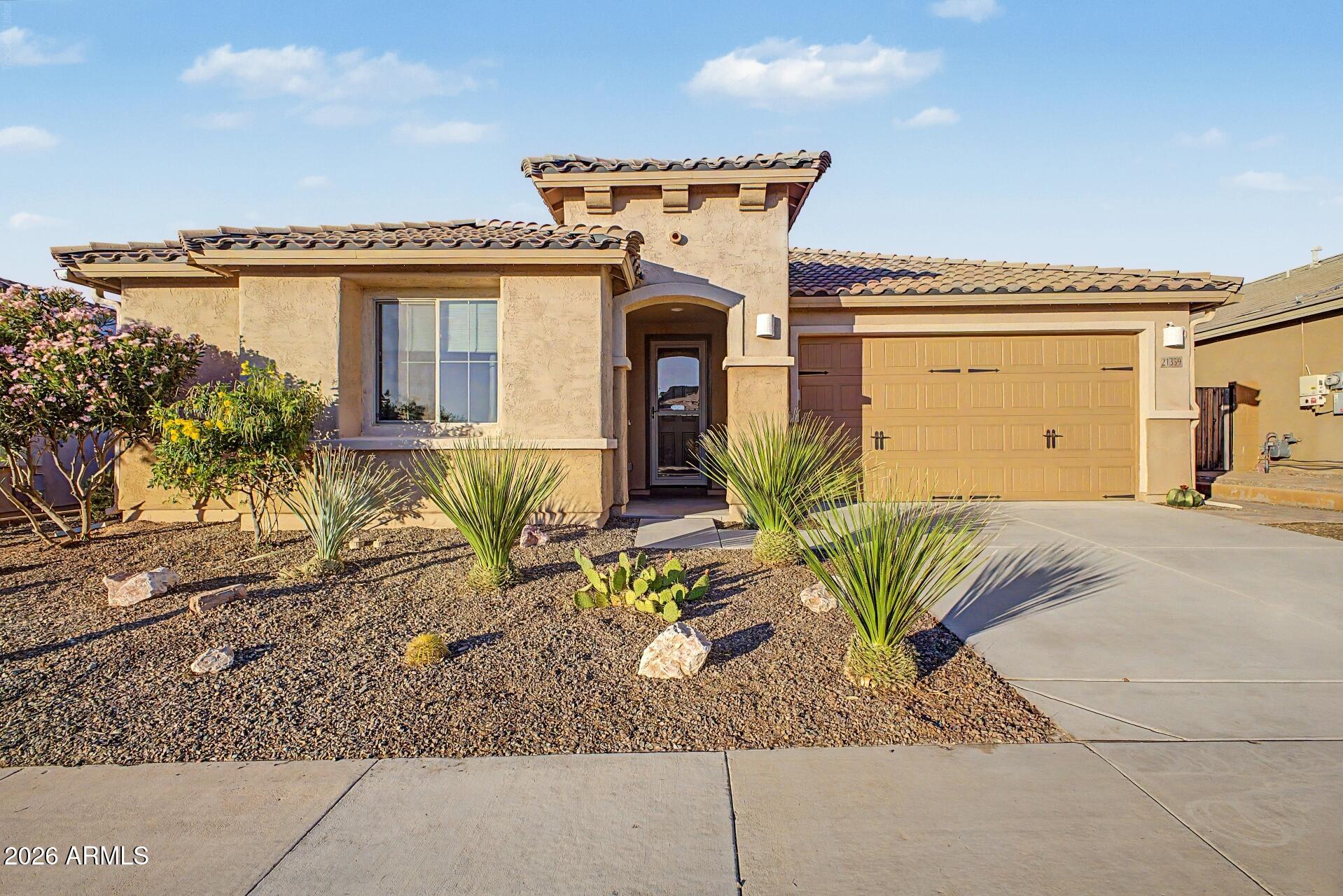 Welcome to this stunning home in the highly desirable Festival Foothills community, offering exceptional upgrades, energy efficiency & resort style  living. The gorgeous kitchen features 42'' cabinets, granite counter tops, a large island & pantry, overlooking the spacious greatroom.  The primary suite is a luxurious retreat with a large walk-in shower, dual vanities & an oversized walk in closet. Owner also installed a mini split for maximum comfort. 3 additional bedrooms & 2 additional full baths provide plenty of space for family & guests. Step outside to your backyard oasis, complete with a sparkling heated & chilled pool featuring a beautiful waterfall, a putting green and covered patio ideal for relaxing or entertaining.  If all that is not enough PAID FOR SOLAR- NO LEASE TO ASSUME Owner paid off the $30k solar system, so you can reap the benefits of a lower utility bill. Additional upgrades include a gas stub for future built in BBQ, gutters with water catchment system ( this can be removed ), Generator interlock installed, new dishwasher in 2025, mature pomelo/grapefruit tree & multiple wall safes. This home is situated on a premium lot with no homes behind it. Truly move in ready, just waiting for it's new owner! NOT AGE RESTRICTED