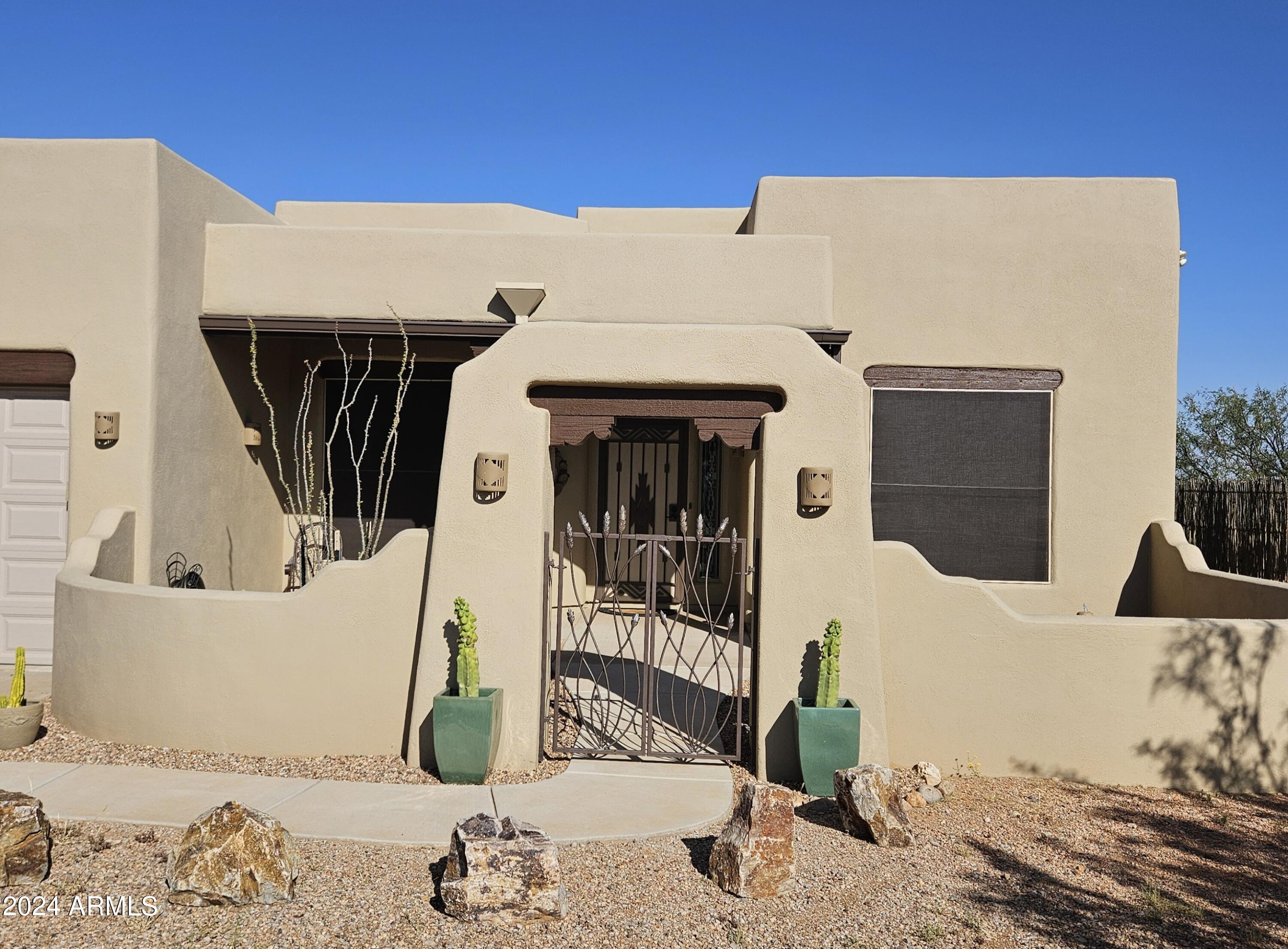 Exceptional Santa Fe Home with Horse Property on pavement with 7.26 acres. Completely fenced and cross fenced. Horse ready with nice flat pasture areas and Mesquite trees! Between the Huachuca Mountains and the San Pedro River. It really does not get any better!!! 3 bedroom, 2 bath with recently enclosed large screened in back patio. Many nice upgrades done within the last few years to include Granite countertops. Home has Saltillo Tile throughout. Detached workshop/Casita type unit.  Additional 7.27 Acres to the East and Additional 16.01 Acres to the North are also available.