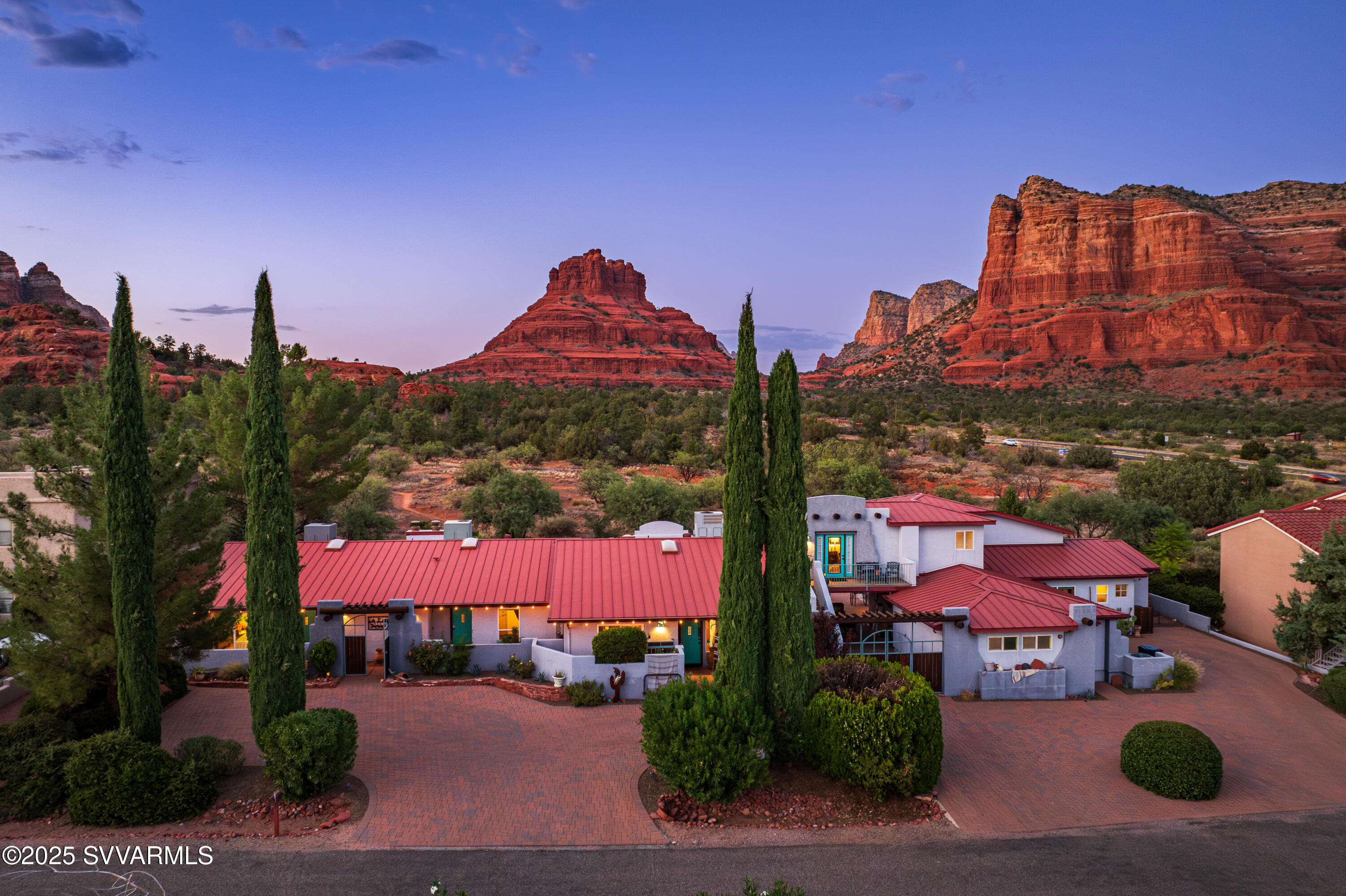 Extraordinary opportunity to purchase an established, successful Sedona boutique B&B! Experience the heart of Sedona's natural beauty at the Cozy Cactus, nestled in the breathtaking landscape of Sedona's most iconic red rock formations. With its intimate atmosphere, unparalleled panoramic views, back-door hiking access to A+ hiking trails and its prime location along Sedona's famed Red Rock Scenic Byway, the Cozy Cactus Resort is a cherished destination for travelers seeking tranquility, rejuvenation, & adventure. Guests return time and time and again to soak in the desert ambiance, and make the most of their vacation time in the spectacular beauty of the Southwest. Turn-key hospitality businesses rarely come for sale in Sedona. Schedule your private showing today. I. Investment Highlights:

- Prime Sedona location near top attractions
- Panoramic red rock views from all guest areas
- Backs to Coconino National Forest with private hiking trail from back patio
- Turnkey business with high occupancy rates and loyal clientele
- Outdoor spaces for events, retreats, and weddings
- Unique accommodations with curated Southwestern charm and modern comfort
- Easy access to hiking, dining, arts, and wellness experiences
Huge potential for revenue stream expansion with the new 2024 Yavapai County special-use permit for weddings & events.

II. Property Overview:

- Premier Location: Located along Sedona's Red Rock Scenic Byway, the Cozy Cactus offers unmatched convenience to world-renowned hiking trails, such as Bell Rock Pathway and the Slim Shady Trail, and easy access to Sedona's thriving arts scene, gourmet dining, and charming local galleries & shops. This prime position makes the resort an ideal base for visitors looking to explore the area's natural wonders while staying close to modern conveniences.

- Magnificent Red Rock Views: The resort is perfectly positioned to capture panoramic views of Bell Rock, Courthouse Butte, the Seven Warriors, and Castle Rock. Guests can relax on the expansive patios and enjoy breathtaking sunrises and sunsets over the pristine National Forest landscape.

- Turnkey Business Opportunity: The Cozy Cactus is a fully operational resort with a stellar Google 5-star reputation, offering an exceptional business opportunity. This turnkey operation includes a loyal guest base, consistently high occupancy rates, and glowing reviews across major travel platforms. Whether you're looking to expand your hospitality portfolio or seeking a new lifestyle venture, this property is primed for continued success.

III. Revenue Potential:

- Weddings: In 2024, The Cozy Cactus received a permit from Yavapai County that allows weddings of up to 75 people. This permit is transferable to the new owner and offers a huge competitive advantage over other hospitality businesses that lack this special permit. This permit also allows for the potential addition of a commercial kitchen, which could be another revenue stream with catering.

- Versatile Income Streams: In addition to the steady occupancy income, the Cozy Cactus offers diverse revenue streams through private events and small group retreats. It's picturesque outdoor areas are ideal for weddings, corporate retreats, and special celebrations, allowing the property to capitalize on Sedona's popularity as both a tourism and event destination.

- Strong Reputation: The resort's outstanding reviews, repeat clientele, and excellent word-of-mouth marketing make it a trusted brand in the Sedona hospitality market. This established reputation provides a strong foundation for continued growth and expansion opportunities. The Cozy Cactus' name, logo, website, and overarching brand are included in the sale of the property. Both the name and logo have been trademarked.

IV: Accommodations:

Diverse Lodging Options: The resort offers a variety of accommodations designed for comfort and relaxation, broken down as follows:

- Unit 1 & 2: Cowboy Hideaway Condo & Sedona Sky Condo: These two condos are nearly identical and feature 2 bedrooms/2 bathrooms plus a full kitchen and living space. Both of these condos feature backdoors that lead onto the expansive patio.
- Unit 3 & 4: The Desert Rendezvous & The Bloomin' Cactus: These two accommodations are king bed studios with their own unique charm.
- Unit 5: Vortex Vista: This is a second level one bedroom/one bath condo that features a kitchenette and a private balcony with sweeping red rock views.
- Unit 6: The Courthouse: This is the largest rental at The Cozy Cactus and offers 2 bedrooms/2 bathrooms with additional loft space that features a sleeper sofa. The Courthouse has a fullly equipped chef's kitchen, walk-in rain shower, soaking tub, washer/dryer, 2-car garage, a private balcony and patio with its own grill and firepit. A phenomenal place for the whole family to stay.
- Common Kitchen, Dining, and Laundry: This is the hub and heart for The Cozy Cactus All guests have access to this welcoming space. Guests can pull up a chair at the dining table and treat themselves to a snack at the "chips and dip" station. The completely stocked kitchen features a gas range, a full size refrigerator, and large dining room. There is also communal laundry on-site.

V. Activities & Nearby Attractions:

- Access to Nature: Located steps away from some of Sedona's best hiking and biking trails, the Cozy Cactus is the perfect destination for outdoor enthusiasts. Guests can walk out their door connect to trails to explore Sedona's iconic Bell Rock and Courthouse. There is also direct access to popular Slim Shady trail, that leads to an array of other trails just minutes away.

- Adventure & Wellness: From off-road jeep tours to hot air balloon rides over the red rocks, Sedona offers endless opportunities for adventure. For those seeking relaxation, nearby wellness centers and spas provide the perfect retreat after a day of exploring.
- Charming Local Culture: Beyond the natural beauty, the Cozy Cactus is ideally situated to explore Sedona's thriving arts scene. Guests can visit nearby galleries, attend local festivals, or enjoy the vibrant culinary landscape, all within a short drive from the resort.

In Conclusion:

Don't miss out on this exceptional opportunity to own a thriving business in the world-renowned destination of Sedona. The Cozy Cactus Resort embodies the best of what Sedona has to offernatural beauty, tranquility, and adventureall while providing the comforts of home in a resort setting. The Cozy Cactus combines lifestyle, profitability, and one-of-a-kind views in one of Arizona's most magical destinations. Schedule your private showing today.