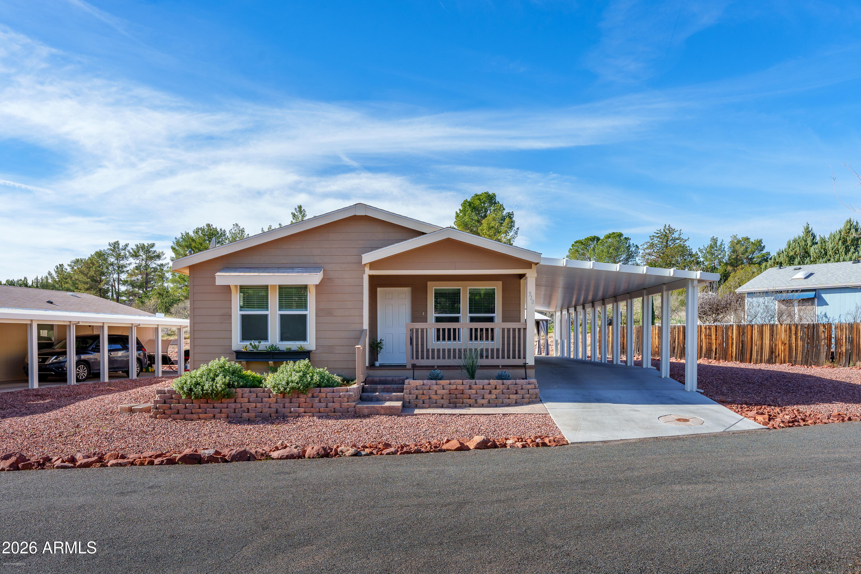 This beautiful home was built in 2024 & the detailed upgrades make it feel like it's brand new!!! This home is ideally positioned just minutes from Sedona's iconic red rock scenery, world-class hiking trails, dining, shopping, medical services, and cultural attractions making it a comfortable and practical full-time residence for those who want to live close to everything Sedona has to offer, without the congestion of traffic or premium cost of in-town neighborhoods.

Sedona Shadows is a well-established 55+ community known for its close proximity to West Sedona. Residents enjoy access to resort-style amenities including a clubhouse, swimming pool, heated spa, fitness center, BBQ grills, billiards room, organized social activities, and more! While Sedona Shadows offers a wide variety of community-based activities and amenities, this home is thoughtfully designed to provide ample privacy.

The open-concept living, dining, and kitchen areas create an inviting and spacious setting ideal for entertaining. A seamless flow connects the main living space to the outdoors through sliding glass doors, opening to a newly paved patio with extra shading and privacy. Perfect for effortless indoor-outdoor gatherings. Tranquil views of natural Arizona landscaping creates extra privacy and a peaceful atmosphere with minimal visibility of neighboring homes. This thoughtfully designed layout blends comfort, functionality, and scenic surroundings, making it an exceptional space for hosting guests or enjoying relaxed everyday living.

Smart living, scenic beauty, and a community designed for your next chapter.