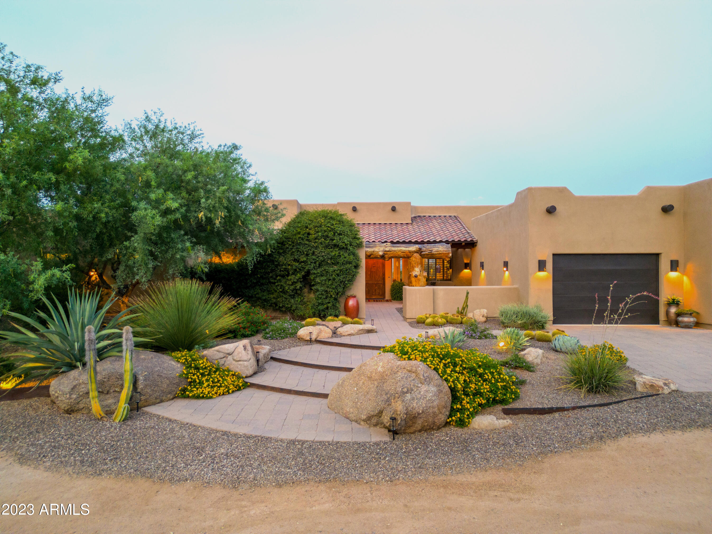 Set on a stunning 7.5 acres with your own private well and jaw dropping views in every direction, this immaculately maintained custom built residence and horse facility caters to your every need. Highlights include: 58x96 custom horse barn with bunkhouse, 5 oversized stalls with large turnouts, saddle wash area, tack room, roping area with remote roping chute, stripping chute, holding pens & return alley. Attention to detail and quality are paramount and the property has a wonderful feel to it. The courtyard entry sets the tone with beautiful desert landscaping and custom viga wood beam posts. The open plan is inviting and well thought out with a great room, chef's quality kitchen, office nook, custom wood beamed ceilings and travertine flooring throughout. The split master suite features a separate soaking tub, his/hers closets and the secondary master suite, best described as your own 'guest suite' with large family room, full kitchen and bedroom suite will wow you. The outdoor highlights include: a huge covered patio, sparking pool, spa and fire pit - ideal for gatherings, additional 24x30 garage, hay barn/carport, 4-RV sites full hookup, 50 amp service, 800 amp electrical hookup/service and space for covered riding arena and additional horse barns. With unobstructed views to the Four Peaks and beyond and miles of riding directly off the property this is an opportunity not to be missed.