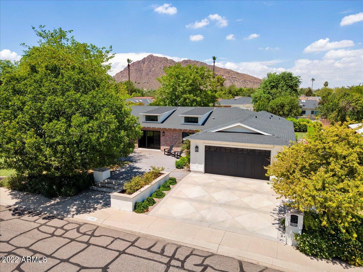 Just a perfect house on one of the best streets in all of Arcadia. Completely remodeled in 2018 with top of the line finishes and new white oak floors  Split floorplan with brand new primary wing.  Total of 4 bedrooms, all en suite with new bathrooms.  A separate office, and a flex room which is currently used as a home gym add to the great functionality of the home.  The kitchen is perfect for entertaining with high end appliances and plenty of seating. Covered patio is super for entertaining and enjoying the Arizona weather.  The large lot is a blank slate, ready for you to make it your own.