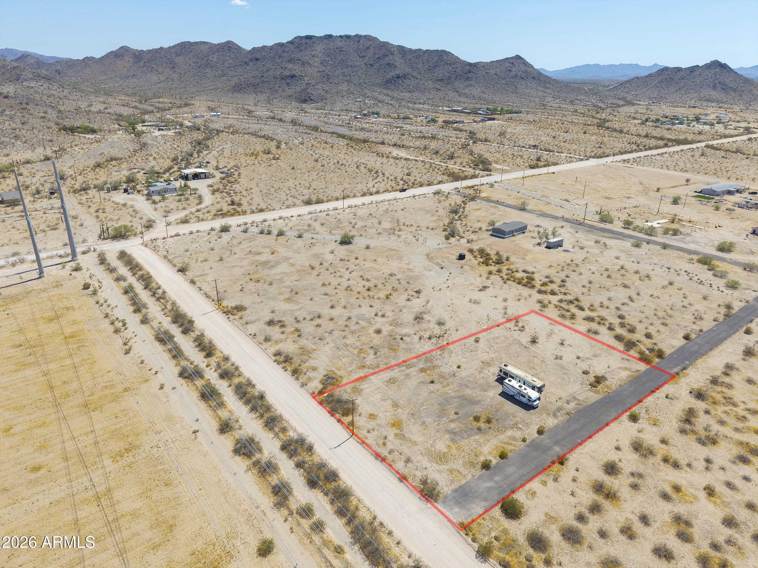 Experience the freedom of wide-open desert living on this 1.24-acre parcel in Hidden Valley! Level, fully cleared & ready for your vision, this property offers shared well access with electric nearby. Build your dream home, bring the horses, RVs & toys & create a space that's truly your own! With NO HOA, gorgeous mountain views, peaceful surroundings & endless Arizona skies, this is the perfect place to enjoy a little more space while still being conveniently located near Maricopa & Casa Grande. Looking for more acreage? Adjacent parcels are also available, giving you the opportunity to create the space & lifestyle you've been dreaming of!