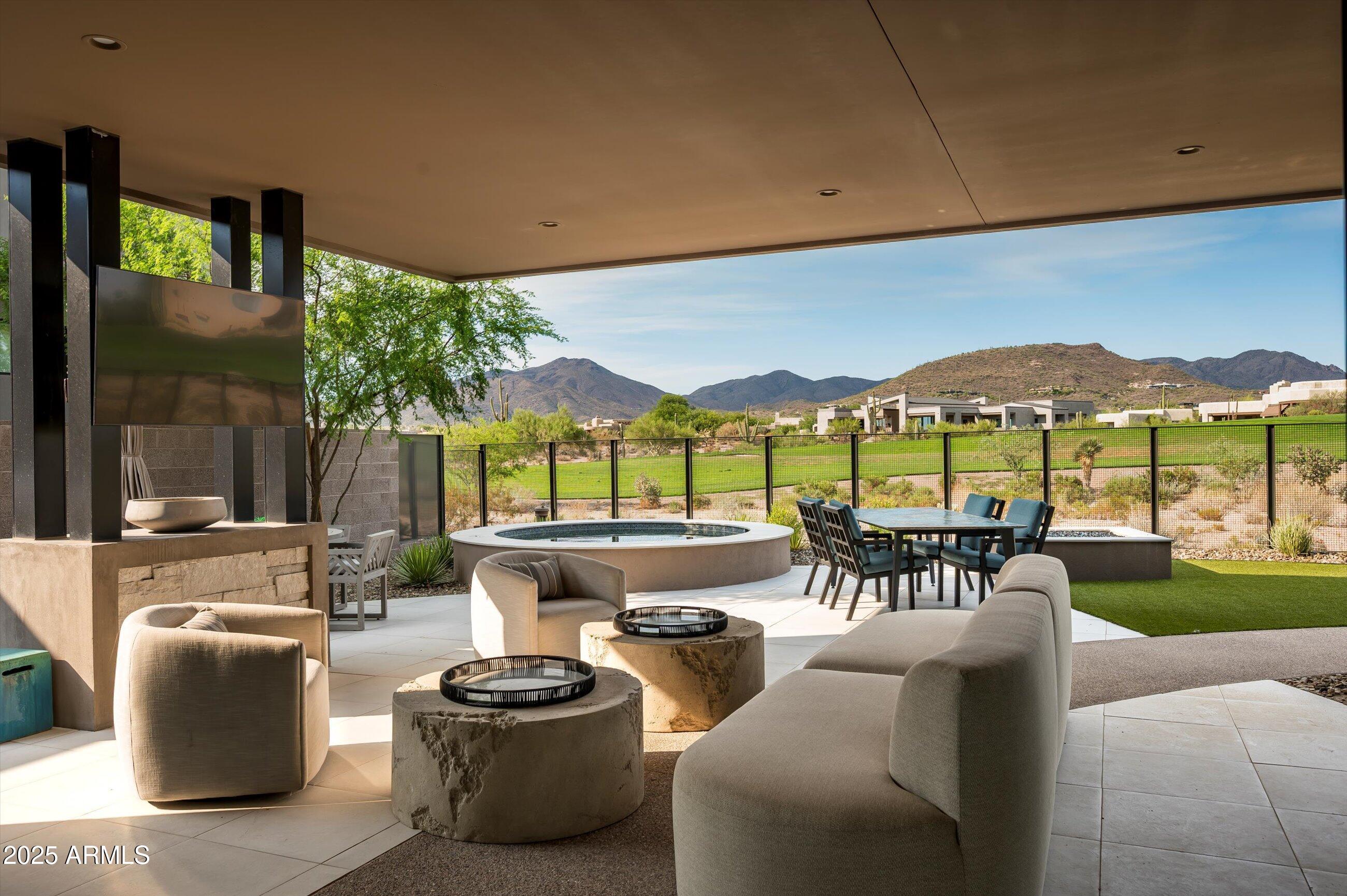 BUYER Walked last minute!  BEST priced Cullum home in Desert Mountain -Golf Membership Available This stunning residence overlooking the 13th hole of Renegade ,SEVEN Desert Mountain features a light-filled, open great room floor plan with three en-suite bedrooms, a separate family room, and a powder room, offering both comfort and flexibility for everyday living or hosting guests.
The expansive chef's kitchen showcases a large center island and is appointed with Subzero, Wolf, and Cove appliances, creating the perfect space for culinary enthusiasts. A sleek modern fireplace anchors the great room, while expansive multi-slide glass doors seamlessly connect the indoors to the spacious covered patio, for Arizona's indoor-outdoor lifestyle. The oversized primary suite offers a serene retreat with its own fireplace, fully appointed walk-in closet, double vanity with a separate makeup station, linen storage, walk-in shower, and a soaking tub.
An impressive climate-controlled wine room and bar, accented with designer tile and custom lighting, enhances the great roomperfect for entertaining or unwinding after a round of golf.
Additional highlights include:
Designer tile and wall treatments throughout
Remotely operated window shades on every window, including great room sliders
Generous storage with a walk-in pantry
Fully finished laundry room
This home blends thoughtful design with modern elegance, making it the perfect retreat in Desert Mountain.