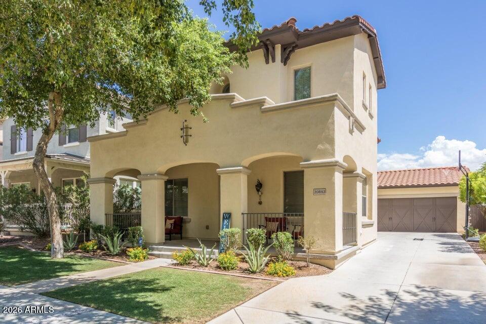 Beautiful, Single Story Pulte home located within the highly coveted Verrado community, residents enjoy picturesque tree-lined streets, championship golf, scenic hiking trails, parks, and a vibrant Main Street, Sunrise Market and brand new Verrado Marketplace all filled with dining, boutique shopping, and entertainment--offering a rare blend of small-town charm and elevated lifestyle amenities all just North or South of home.
Its charming front porch sits directly across from Poets Park and the rest speaks for itself: granite counters, stainless steel appliances and inviting FP. Experience desert living in this wonderfully maintained 3-bedroom, 2.5-bath residence with a spacious loft, ideally situated in the heart of Verrado. Thoughtfully designed and in good condition, this home provides a seamless backdrop to entertain or cozy up with family. From the moment you enter, you're welcomed by an abundance of natural light, elevated finishes, and a flowing open-concept  layout designed for both everyday living and elegant entertaining. The chef-inspired kitchen opens beautifully to the main living space, creating an inviting atmosphere for gatherings both large and intimate. Upstairs, the versatile loft provides a refined flex space--perfect for a private office, media lounge, or additional retreat. The backyard, a very private space, features green grass, covered patio, a serene setting encouraging relaxation and room for details to be added. Whether enjoying quiet mornings or hosting sunset gatherings, this outdoor space delivers both! Make time to come and see this one!