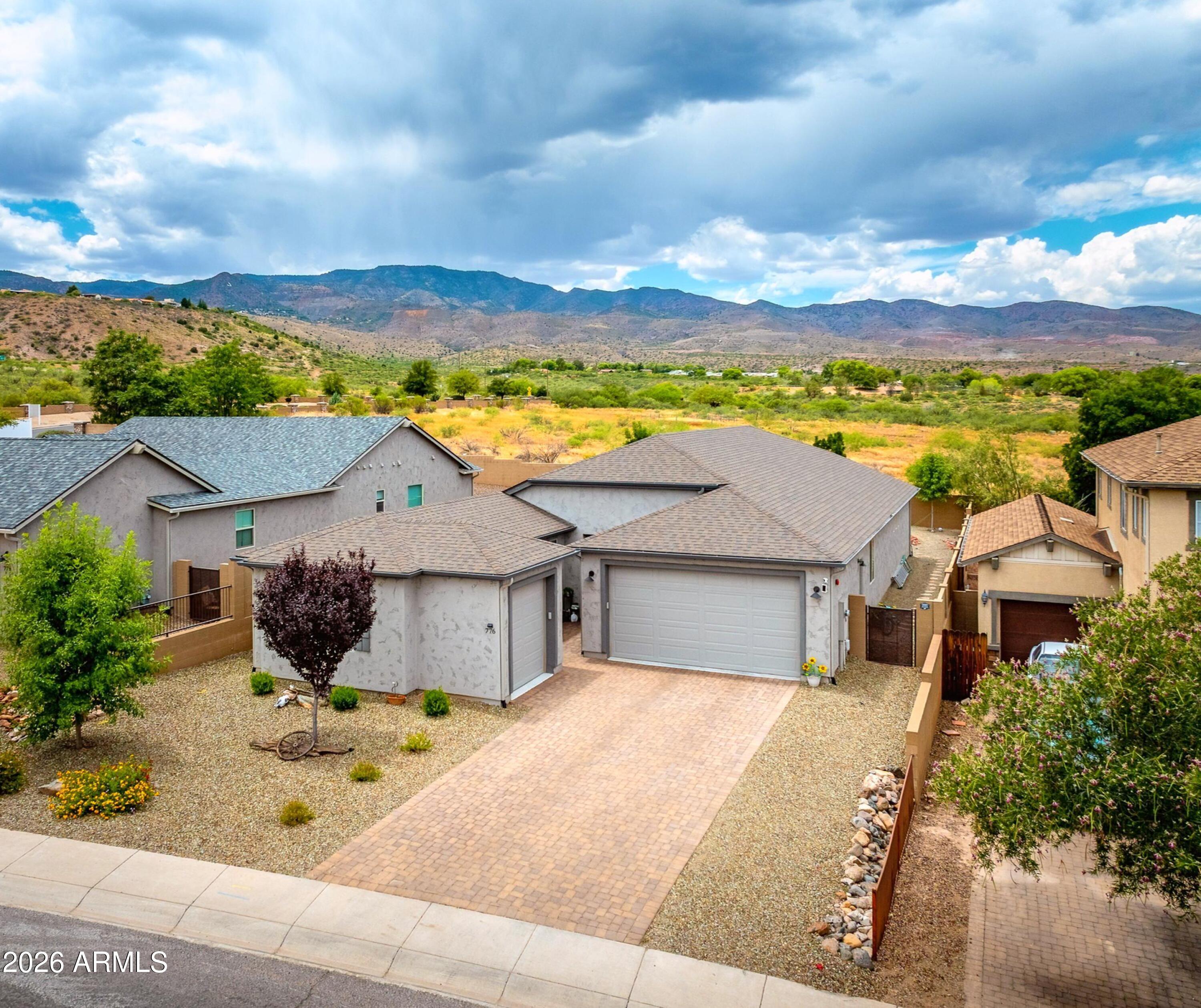 Experience elevated living in this beautifully upgraded 4-bedroom, 3-bath home offering 2,238 sq ft, a 3-car garage, and stunning Mingus Mountain views. The expansive split floor plan features a private en-suite guest bedroom, Office/den space, upgraded cabinetry, premium granite countertops, tile flooring, and stainless steel appliances. 

Enjoy seamless indoor-outdoor living with a covered patio and fully landscaped backyard designed for entertaining, relaxation, pets, and play. Located in a sought-after community with a clubhouse and resort-style amenities, this 2022-built home combines modern comfort with small-town charm. 

Minutes from Clarkdale, Cottonwood, Jerome, dining, recreation, and outdoor adventure.
