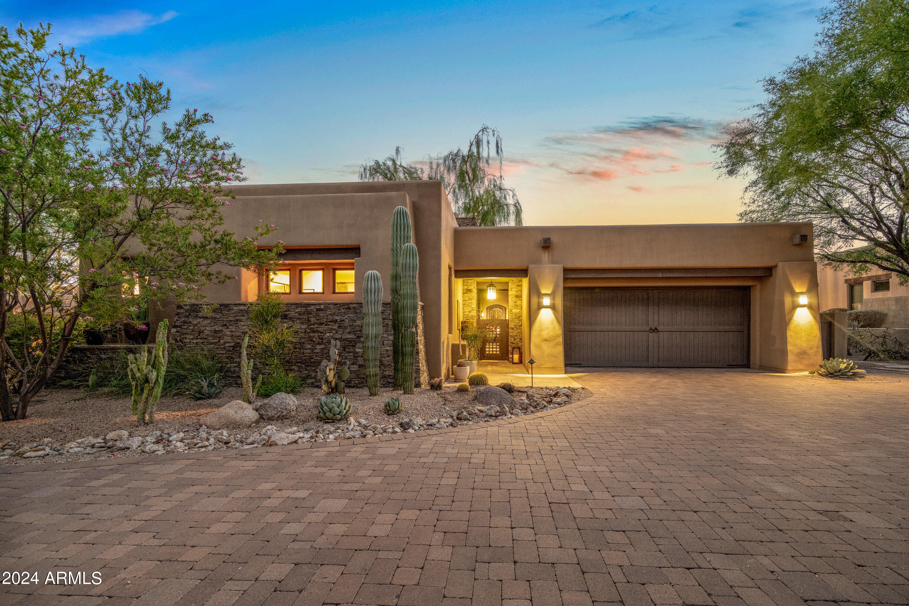 RESORT LIVING AT A RESORT - Come see this stunning three bedroom, 3.5 bath home with separate casita located at Privada within walking distance to the Scottsdale Four Season Resort. The entryway to your new getaway opens onto a private interior courtyard with a
waterfall/gas fireplace and entrances to the casita, office and main house. The majestic cast iron door then leads you directly to the great room and spacious kitchen area. Pass by the small bar area and marvel at the views through the glass sliding doors at Pinnacle Peak. At the touch of a button, the glass doors slide into a wall pocket for true indoor/outdoor living and patio area with a gas fireplace, and built-in gas grill, sink and refrigerator. Then, gaze over in the infinity
pool with spa at Pinnacle Peak and the untouched, protected land behind your property ensures
you will never have your view of the mountain obstructed. A grand master bedroom with a gas
fireplace and large master bath that includes a private outdoor shower, and the second
bedroom also has its own full bath. Guests will also have their own miniature retreat within the
resort in their large casita with full bath, bar with sink and refrigerator and their own gas
fireplace for cozy visits. From your own resort it is a short walk to the Scottsdale Four Seasons
resort with restaurants, pool, spa and exercise facilities and classes. Privada residents are
always welcome and receive the world famous Four Seasons hospitality as well as the option to
become a resort member for significant discounts and access. Be sure to see this gem in North
Scottsdale soon as the properties within this community are rarely available.